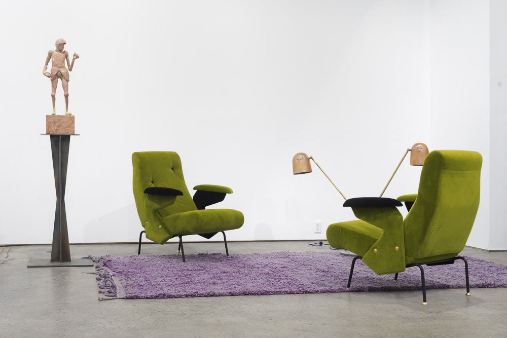 Installation view of Francis Upritchard and Martino Gamper's collaborative show. Green chairs, purple shag rug, and some other works,