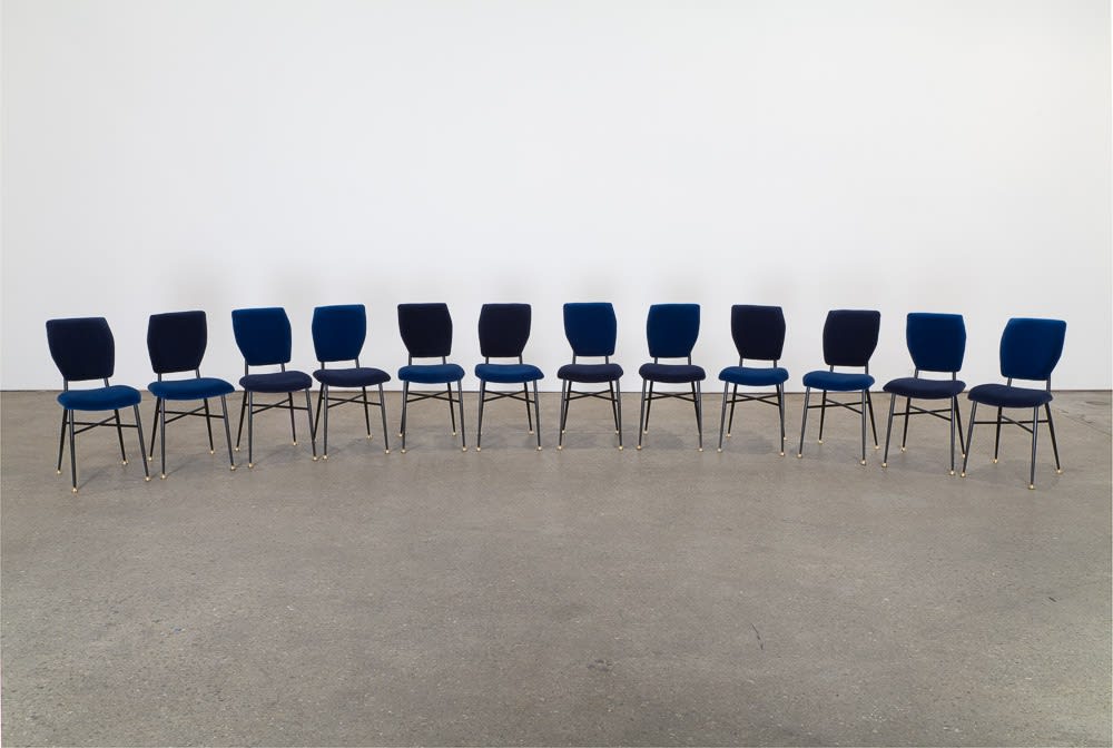 Installation view of Francis Upritchard and Martino Gamper's collaborative show. A semi-circle row of Ice Cream Chairs by Gamper.