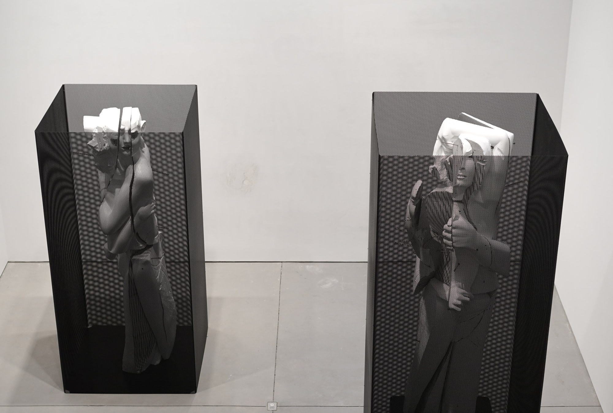 Installation view of Matthew Monahan's solo show. Two standing sculptures.