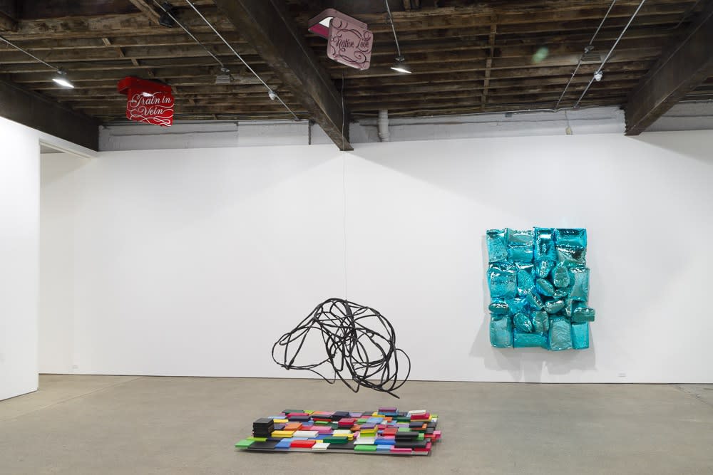 Installation view of Jim Lambie's solo exhibition. View shows Lambie's immersive use of the ceiling.