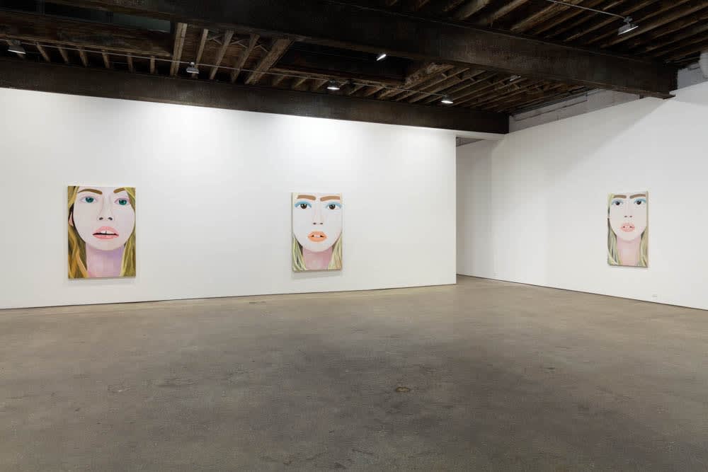 Installation view of Brian Calvin's fourth show at Anton Kern Gallery, featuring a group of paintings of faces, lips, mouths, poses, and a mirror. A few works shown.