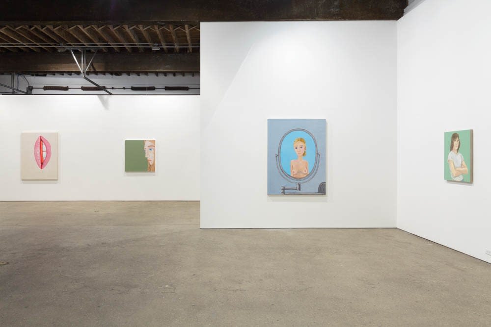 Installation view of Brian Calvin's fourth show at Anton Kern Gallery, featuring a group of paintings of faces, lips, mouths, poses, and a mirror. Multiple works featured, notably a girl a mirror.