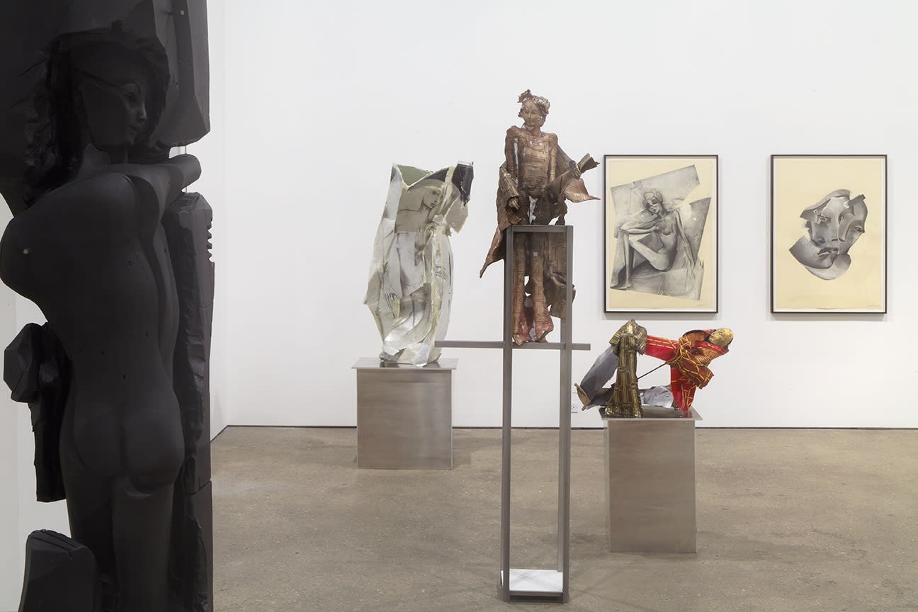 Installation view of Matthew Monahan's sixth solo show at Anton Kern Gallery, featuring sixteen sculptures, a set of drawings, two wall-mounted masks, and a single large figure in the back room. A few more works presented.