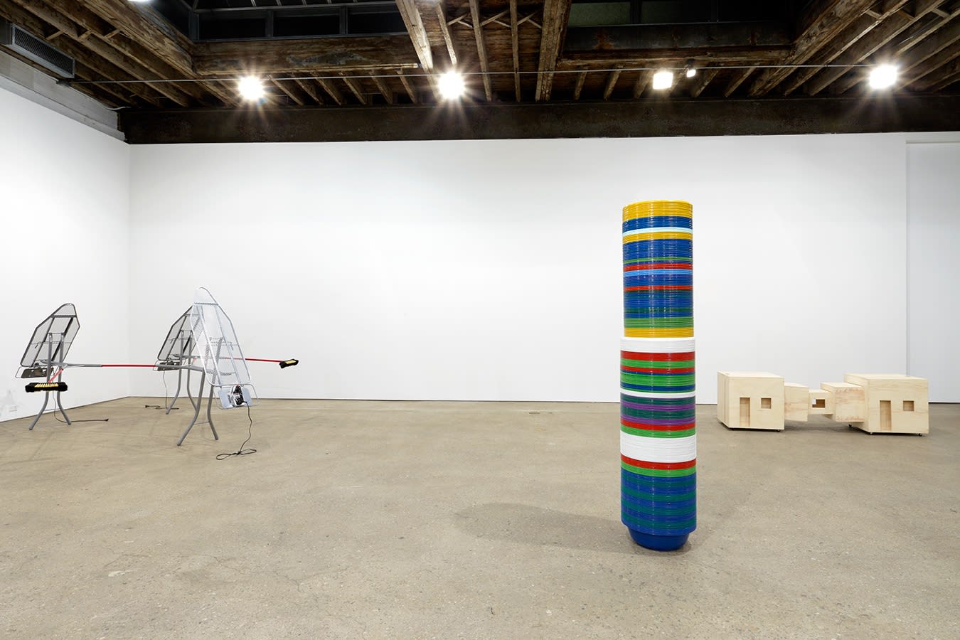 Installation view of Marepe's third solo show at Anton Kern Gallery, featuring seven readymade sculptures. An additional vantage point of the show.