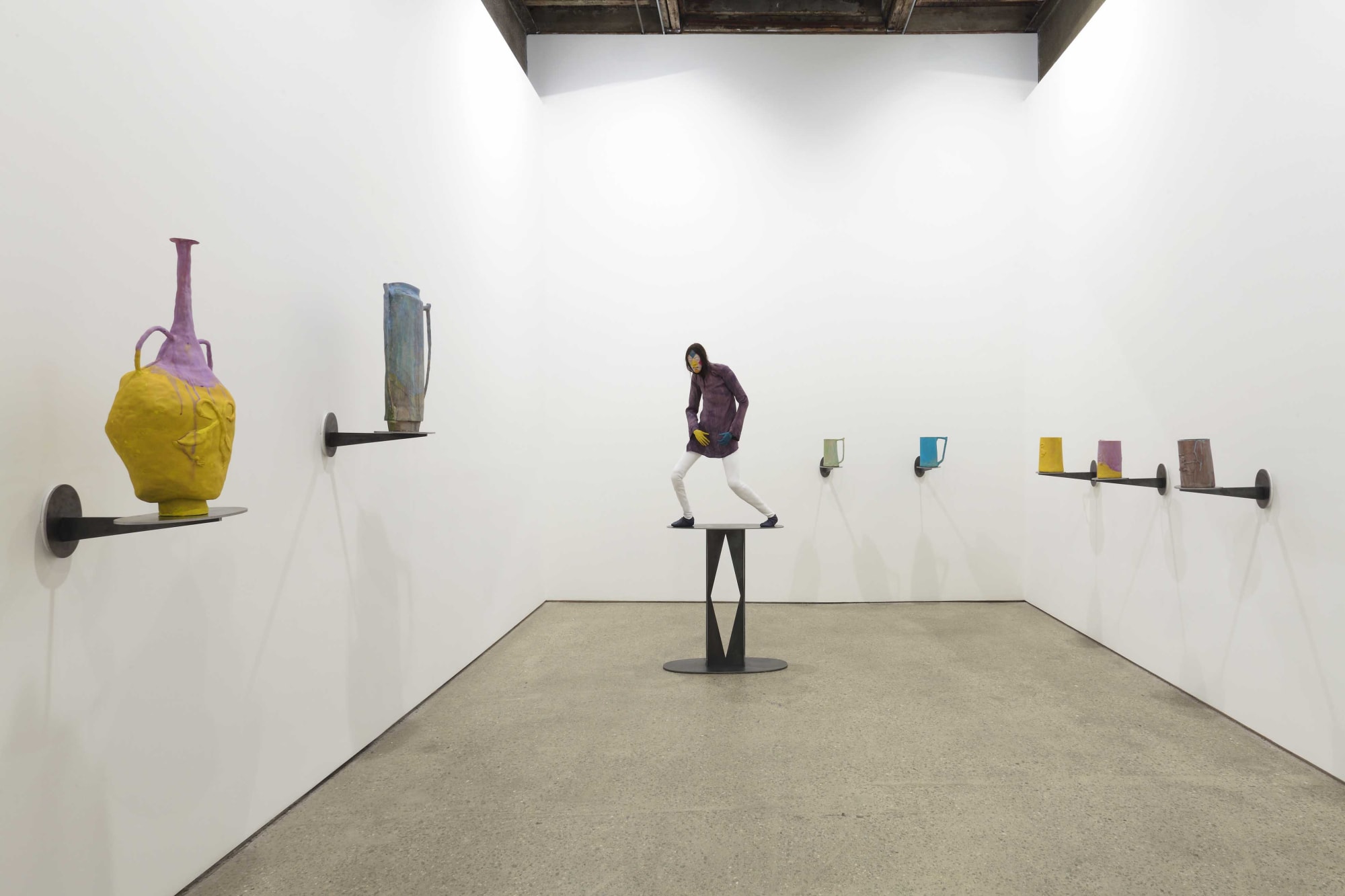 Installation view of Francis Upritchard's debut New York gallery show, featuring figurative and ritualistic sculptures as well as a collection of pots. The backroom showcasing pots and one single figure.