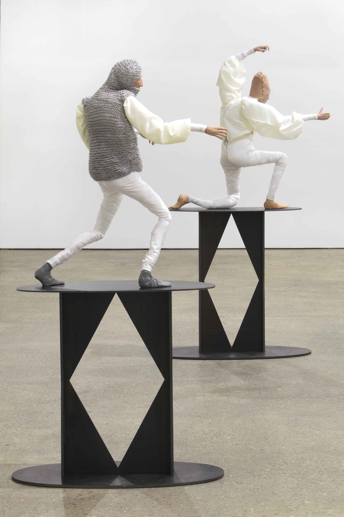 Installation view of Francis Upritchard's debut New York gallery show, featuring figurative and ritualistic sculptures as well as a collection of pots. Detail of two of the figures.