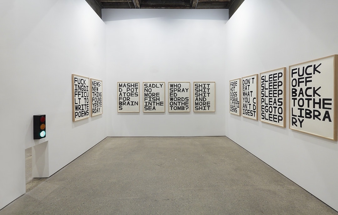 Installation view of David Shrigley's fifth solo show at Anton Kern Gallery, featuring signs. Featuring the back room signs.