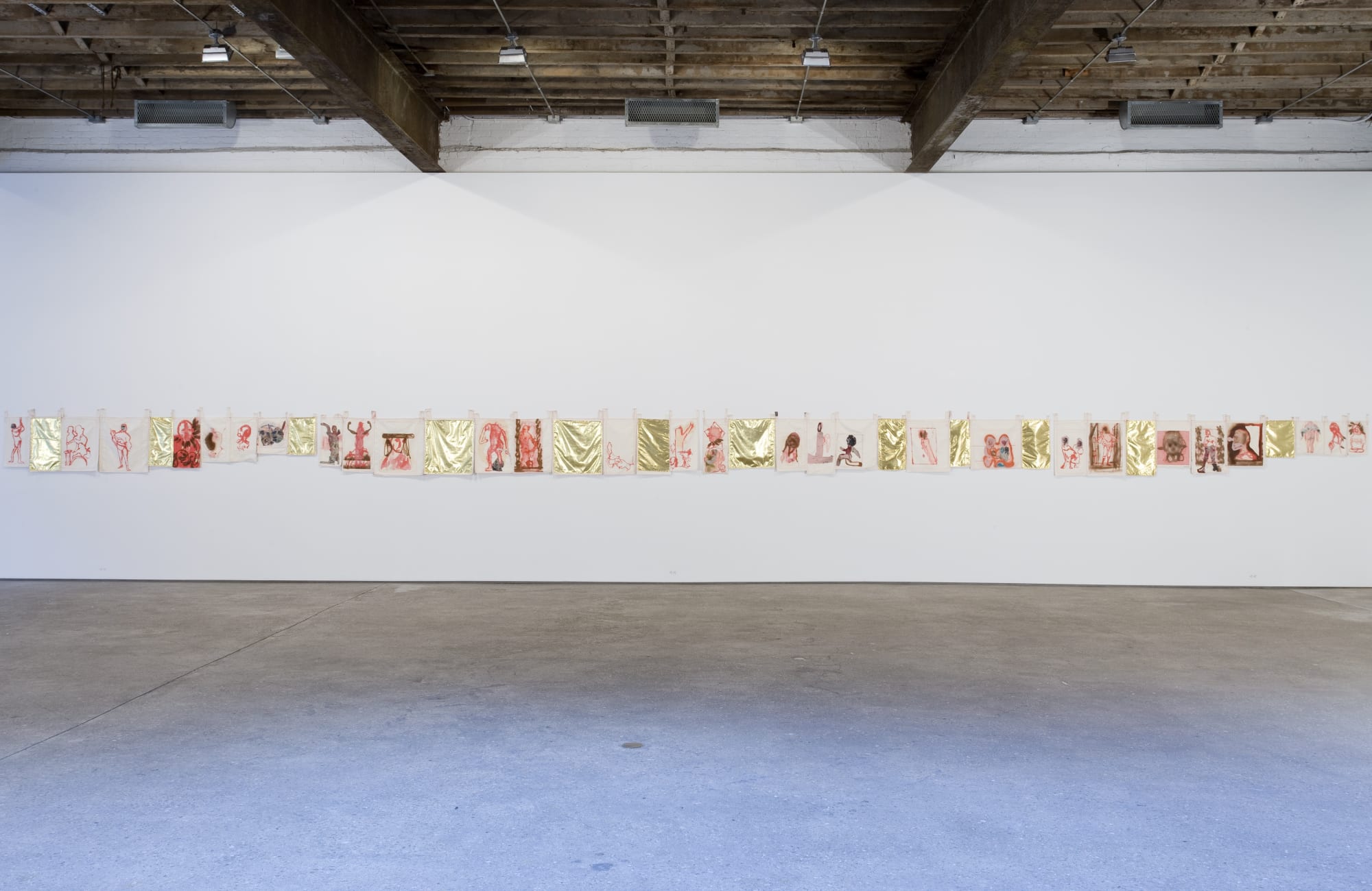Installation view of Alessandro Pessoli's fourth solo show which features drawings, paintings, collage, and sculpture. Pictured here is Red People Gold Sky, a long textile of oil and spray paints interwoven with paint on canvas as well.