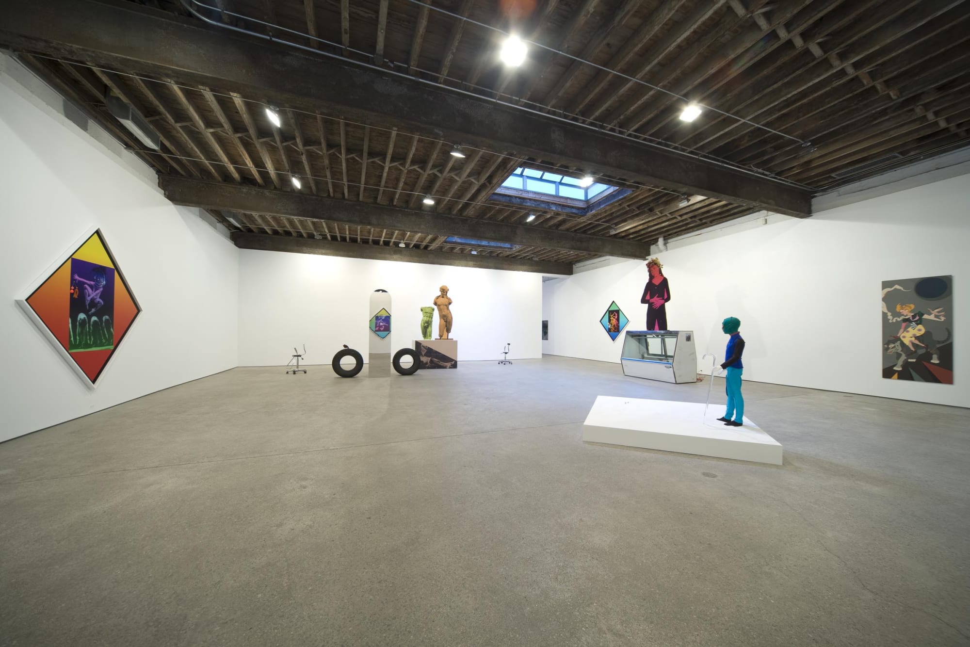 Installation view of Lothar Hempel's solo show, comprised of four figurative sculptures, three diamond photomontages, and one painting. View of all the works.