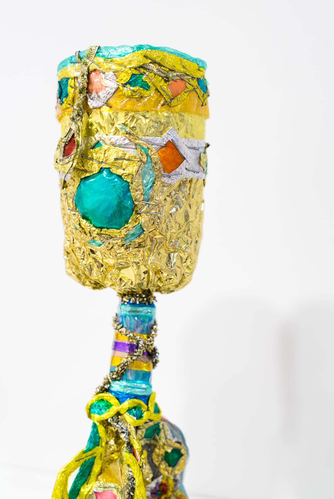Detail of work in the exhibition -- gold cup with rhinestones.