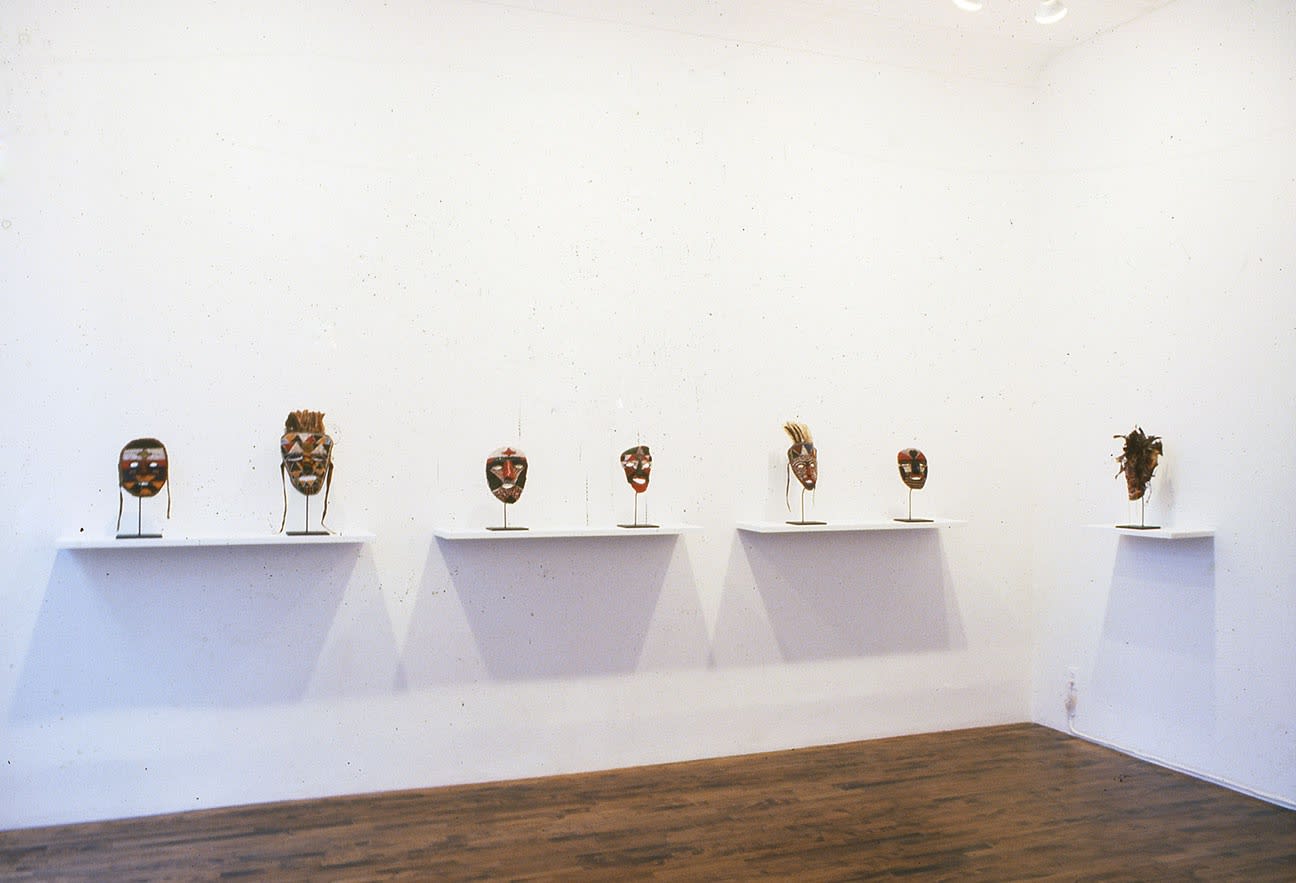 Installation view of Matthew Monahan's first show at Anton Kern Gallery, featuring drawings from the young artist coupled with masks originating from the Tabwa Tribe in Zambia. Five masks featured.