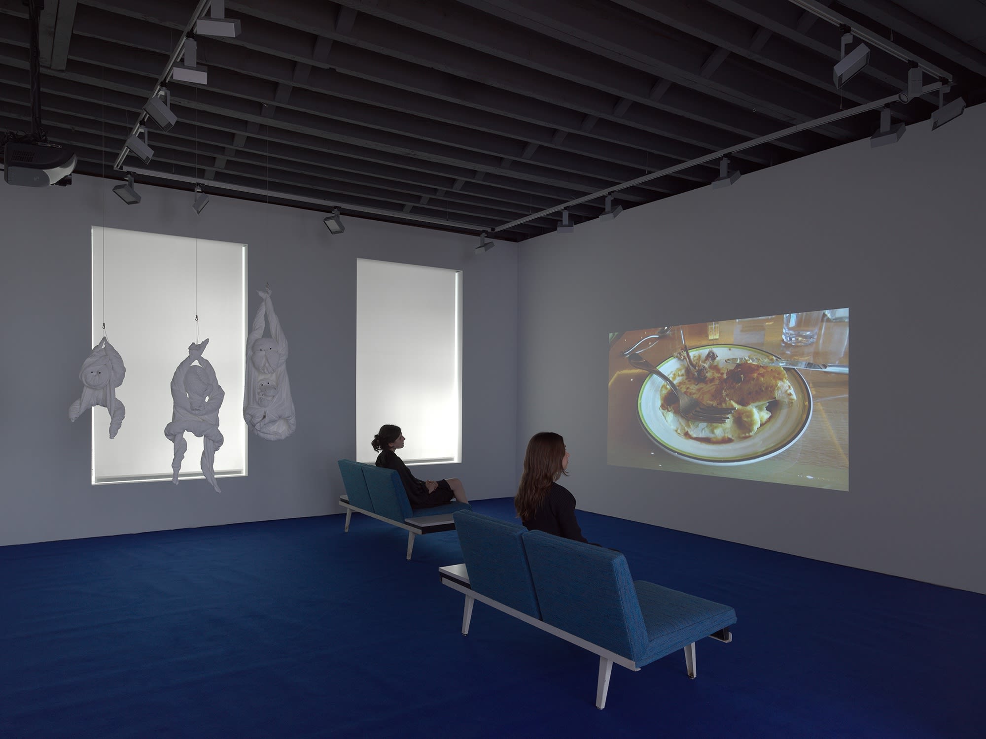 Installation view on the gallery's third floor of Erik van Lieshout's exhibition. Video is featured.