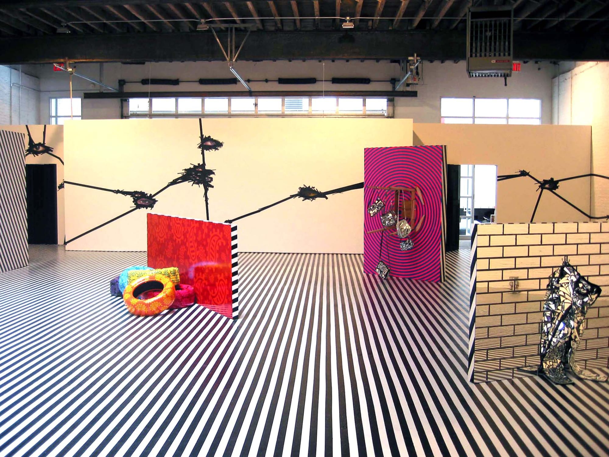 Installation view of Jim Lambie's show titled Mental Oyster. A few sculptures featured.