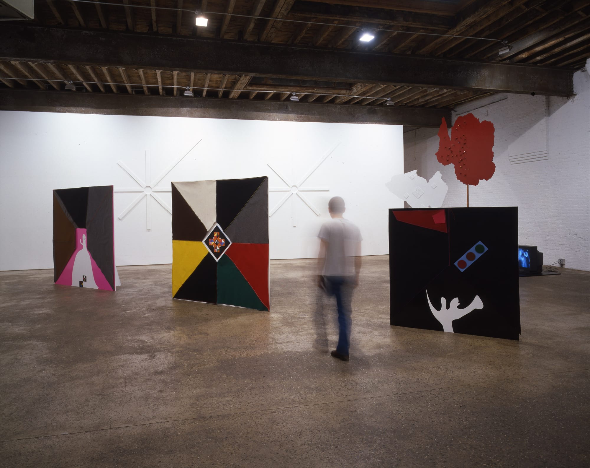 Installation view of Lothar Hempel's fourth solo show at Anton Kern Gallery, a theatrical installation of mixed media works, a video installation, and brain sculptures. Large mixed media works featured.