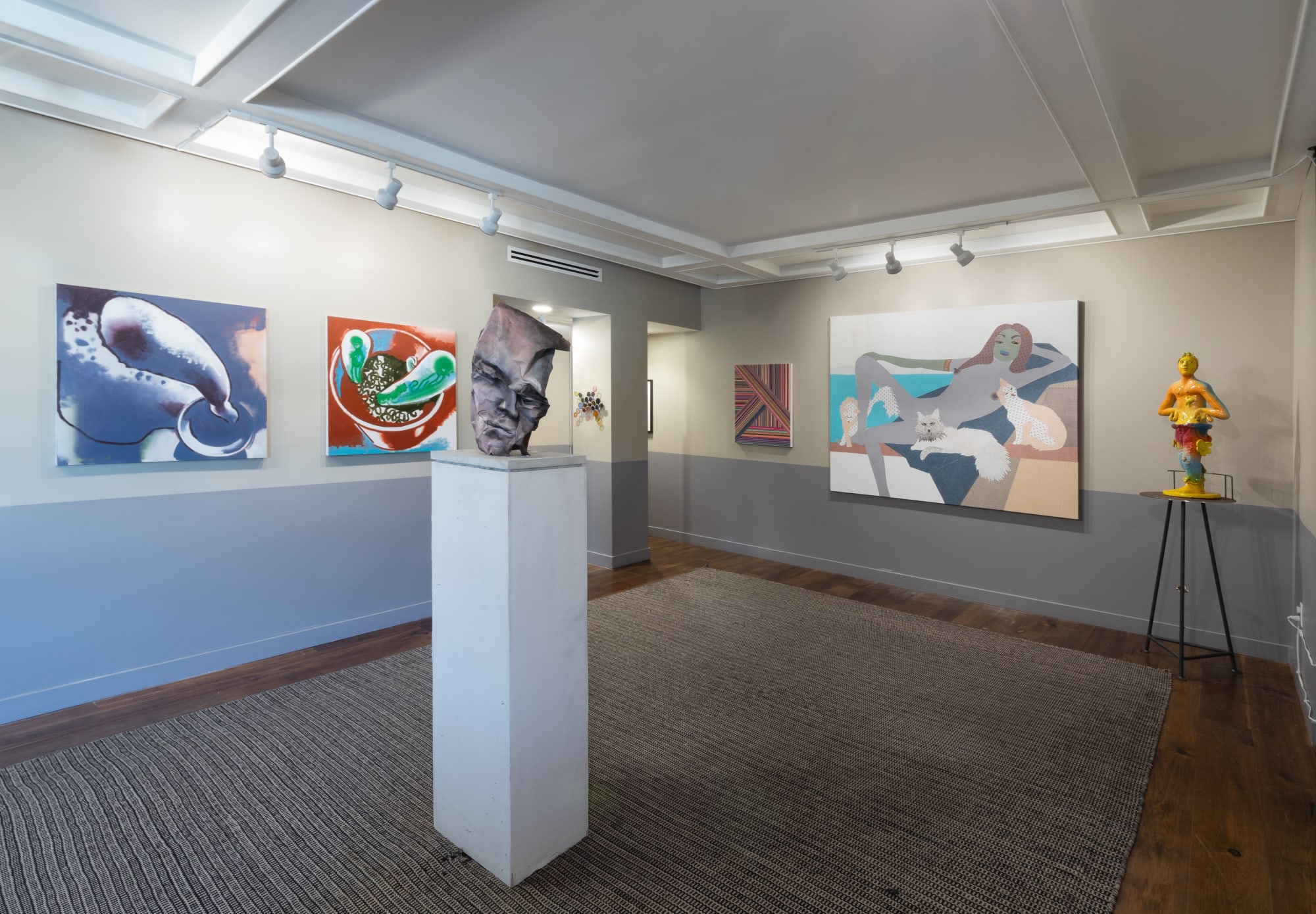 Installation views during Felix Art Fair. Mix of paintings and sculptures by various artists, including Lara Schnitger, Mark Grotjahn, and others.