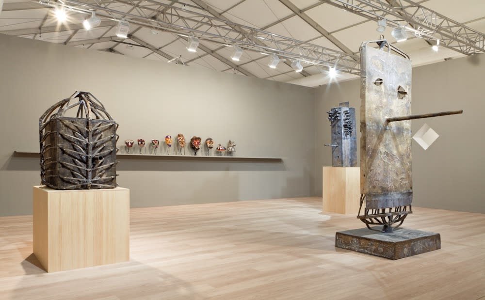 Installation view of Anton Kern Gallery's booth at Frieze London 2014. The show featured Mark Grotjahn and Tabwa Masks. Three sculptures featured.