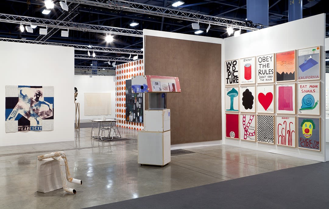 Installation view of the Anton Kern booth at Basel Miami 2012. David Shrigley's works covered one wall.