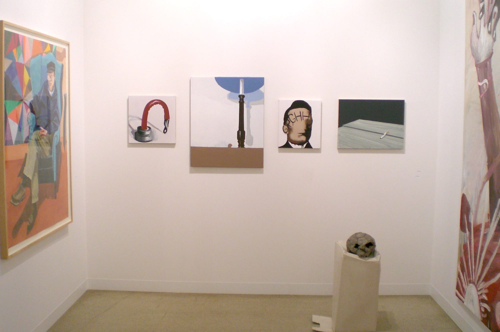 Installation view of the AKG booth at Basel 2007, featuring small-scale works from Wilhelm Sasnal.
