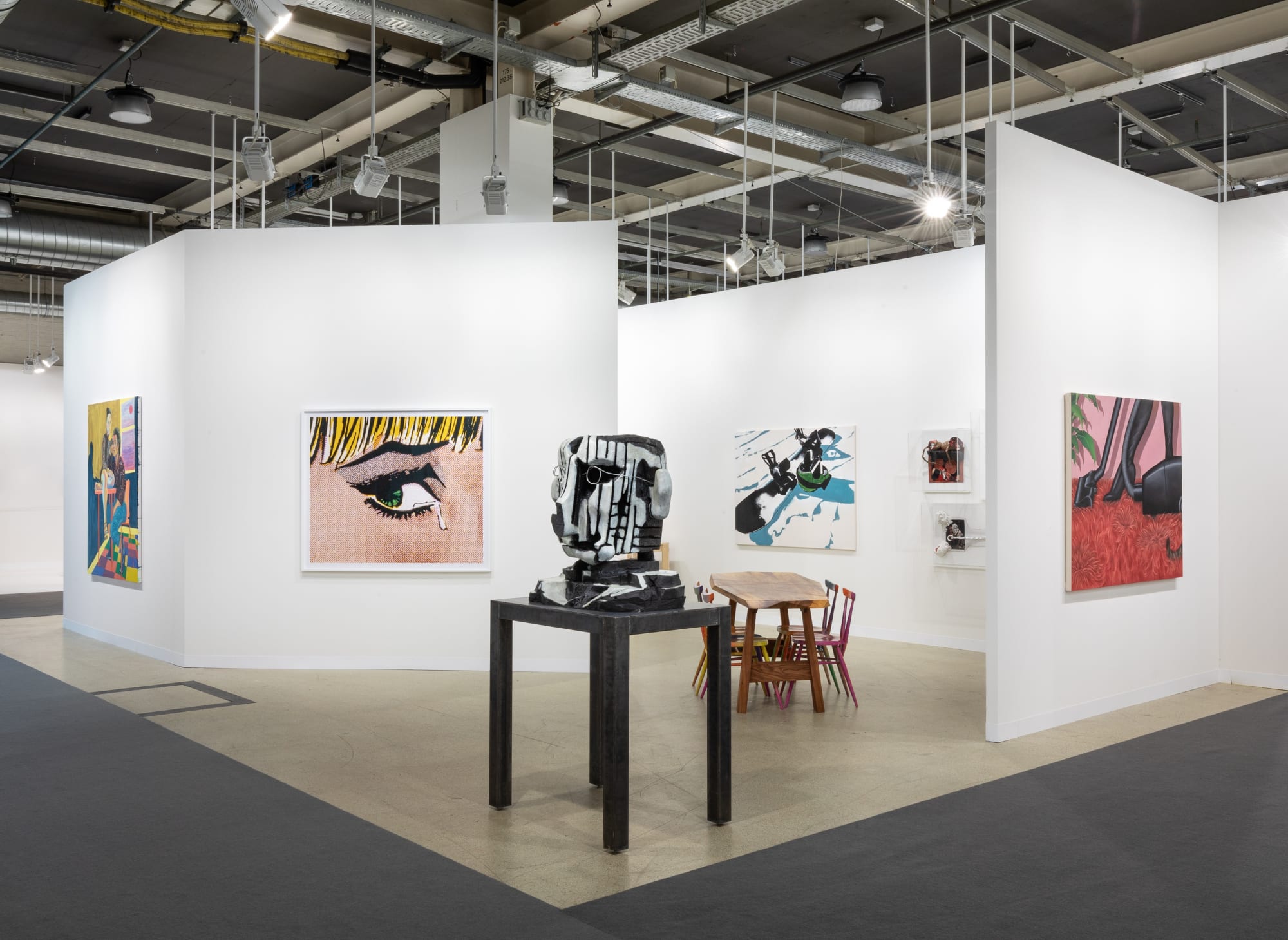 Installation view of Art Basel featuring the majority of works in the both, including sculptures, paintings, and more.