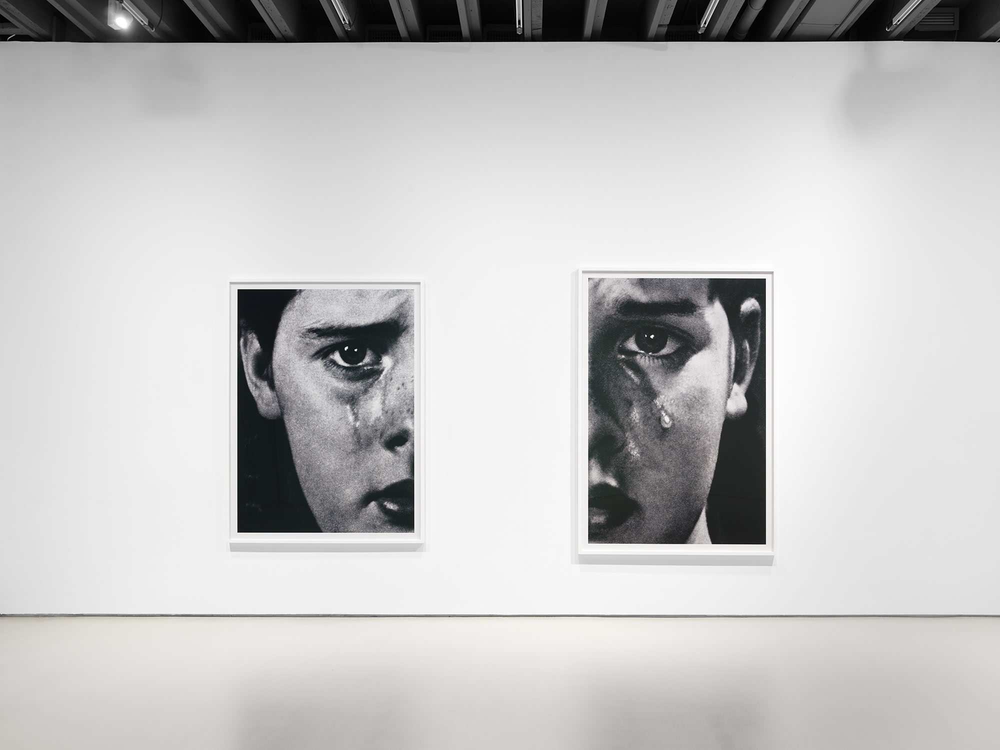 Installation view of Anne Collier's sixth solo show at Anton Kern Gallery, featuring a new body of three distinct groups of works. Diptych of women crying, a common theme in Collier's palette.