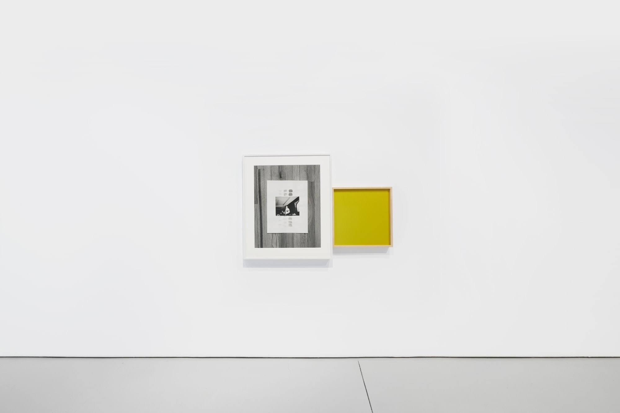 Installation view of the 2022 exhibition "Photographic Pictures" with view of white floors, walls, artworks and cieling