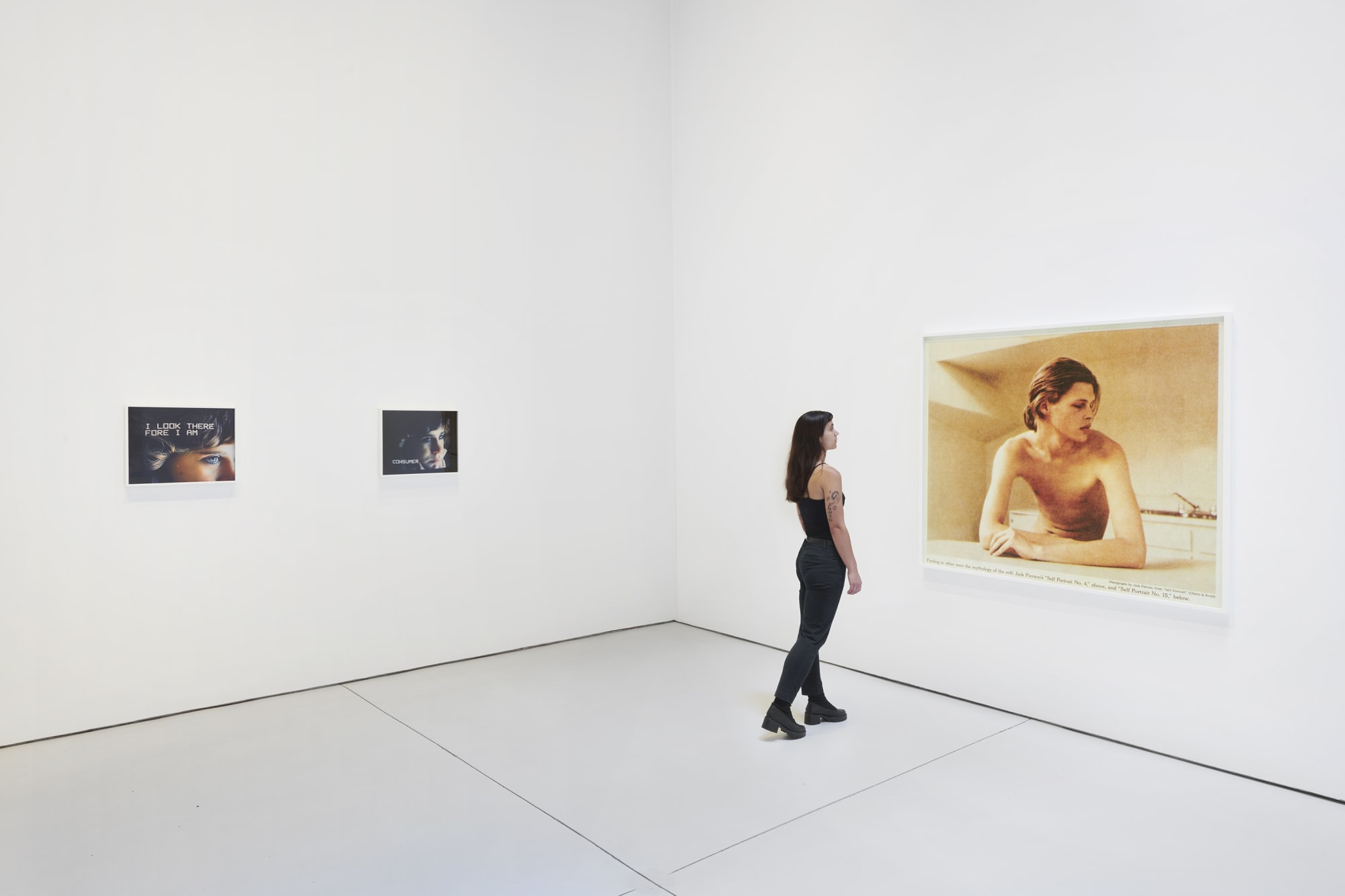 Installation view of the 2022 exhibition "Photographic Pictures" with view of white floors, walls, artworks and cieling. Includes model for human scale