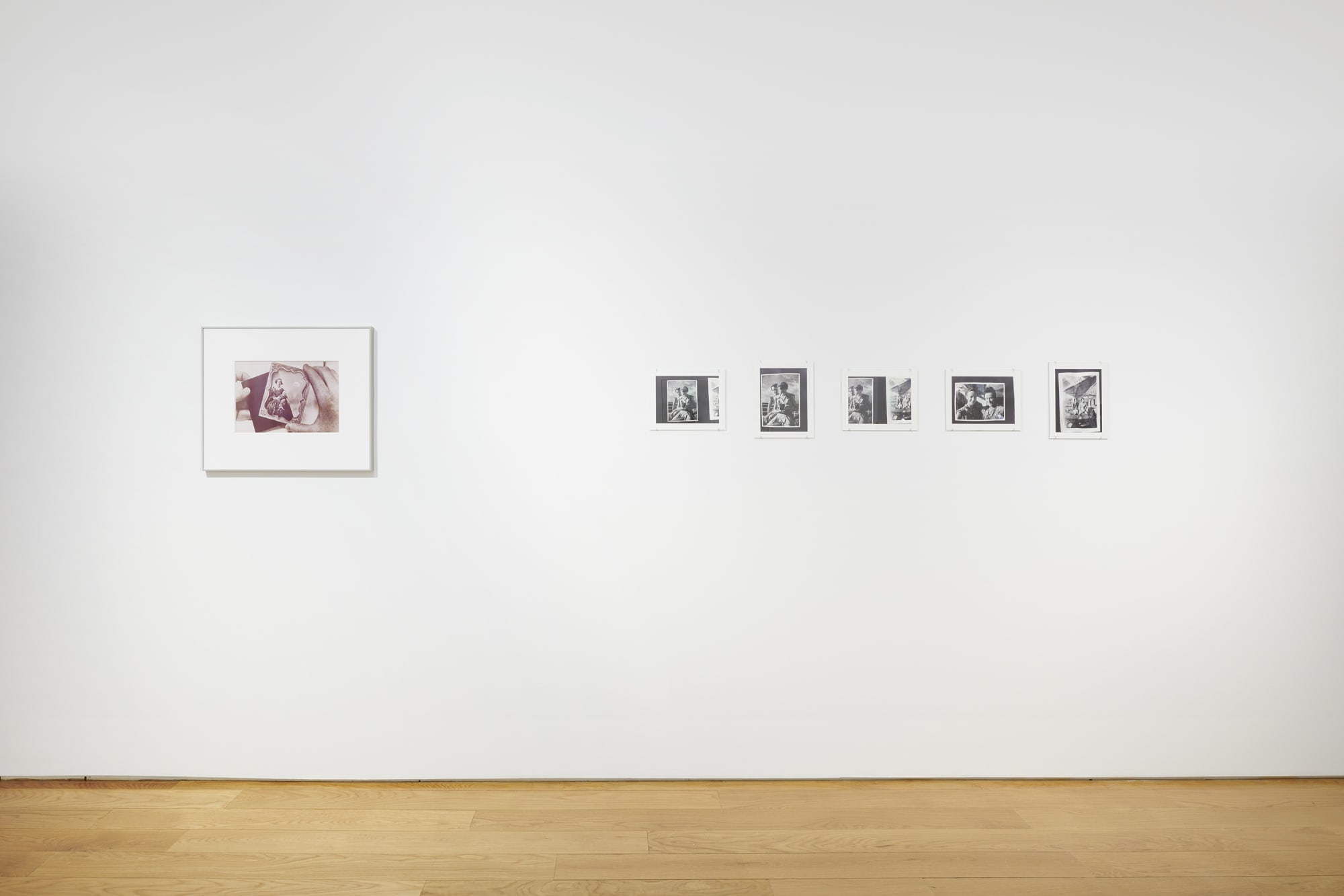 Installation view of the 2022 exhibition "Photographic Pictures" with view of wood floors, walls, artworks.