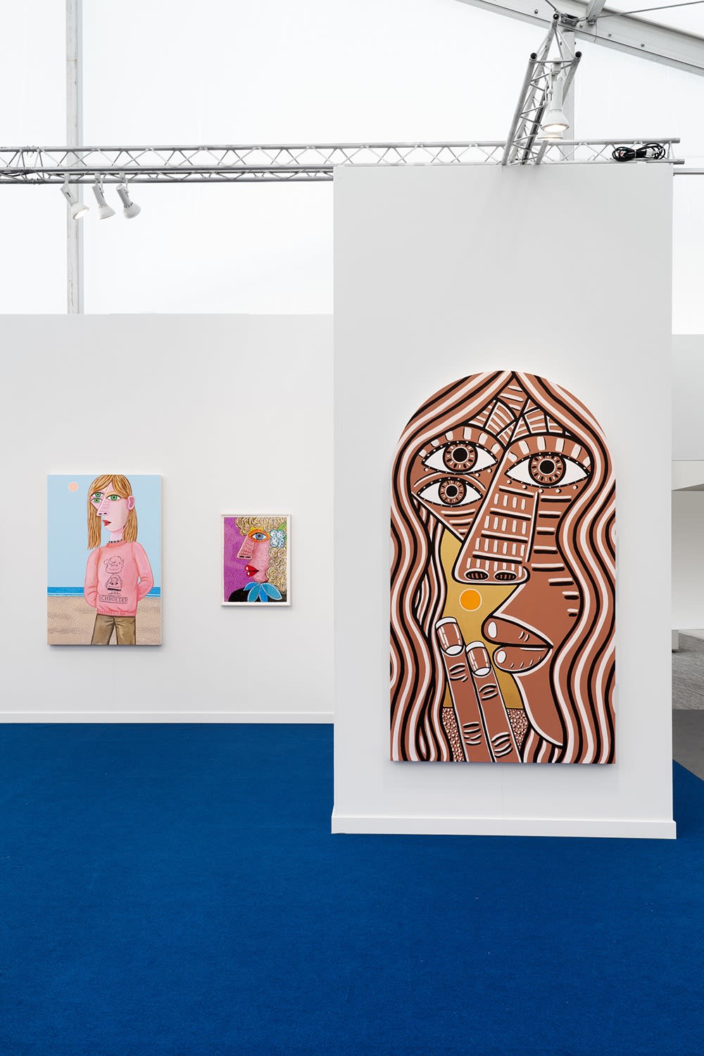 Installation view of Frieze Los Angeles 2023 booth C11 with view of blue floors, walls, artworks and ceiling.