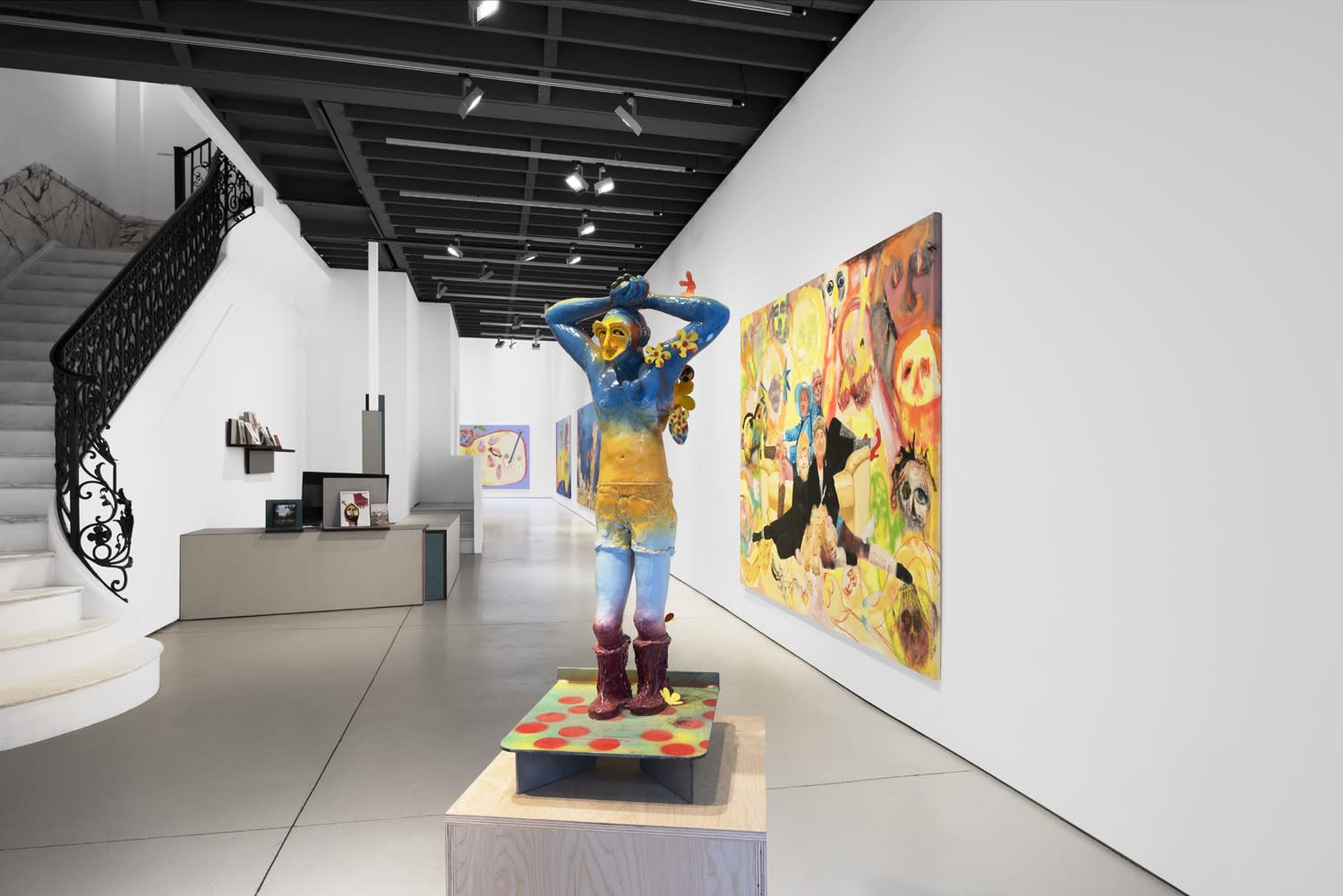 Installation view of the 2023 exhibition “Alessandro Pessoli: Pluto is my Master” with view of white floors, walls, artworks and ceiling.