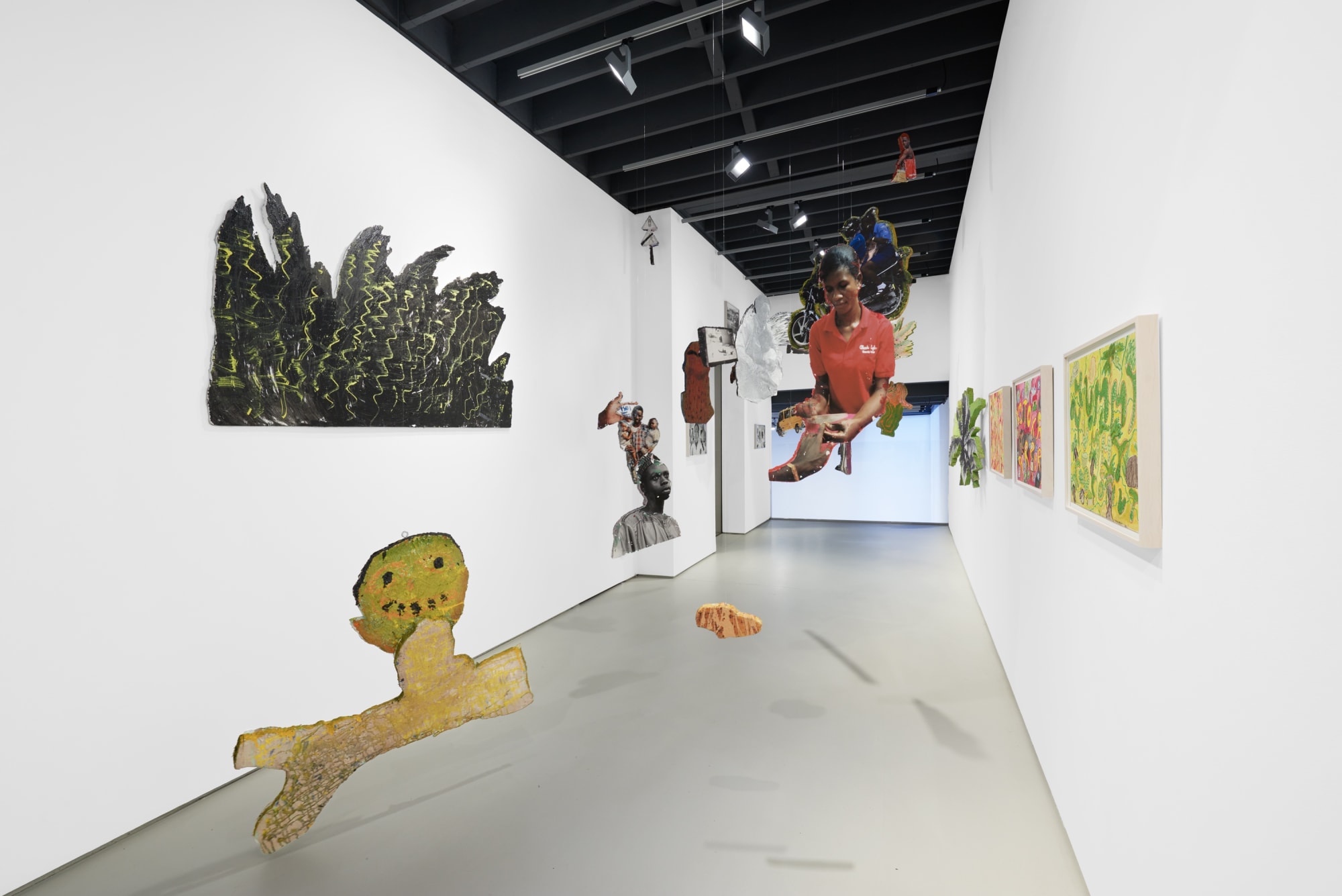 Installation view of the 2023 exhibition “Lloyd Foster: Double Double” with view of white floors, walls, artworks and ceiling.