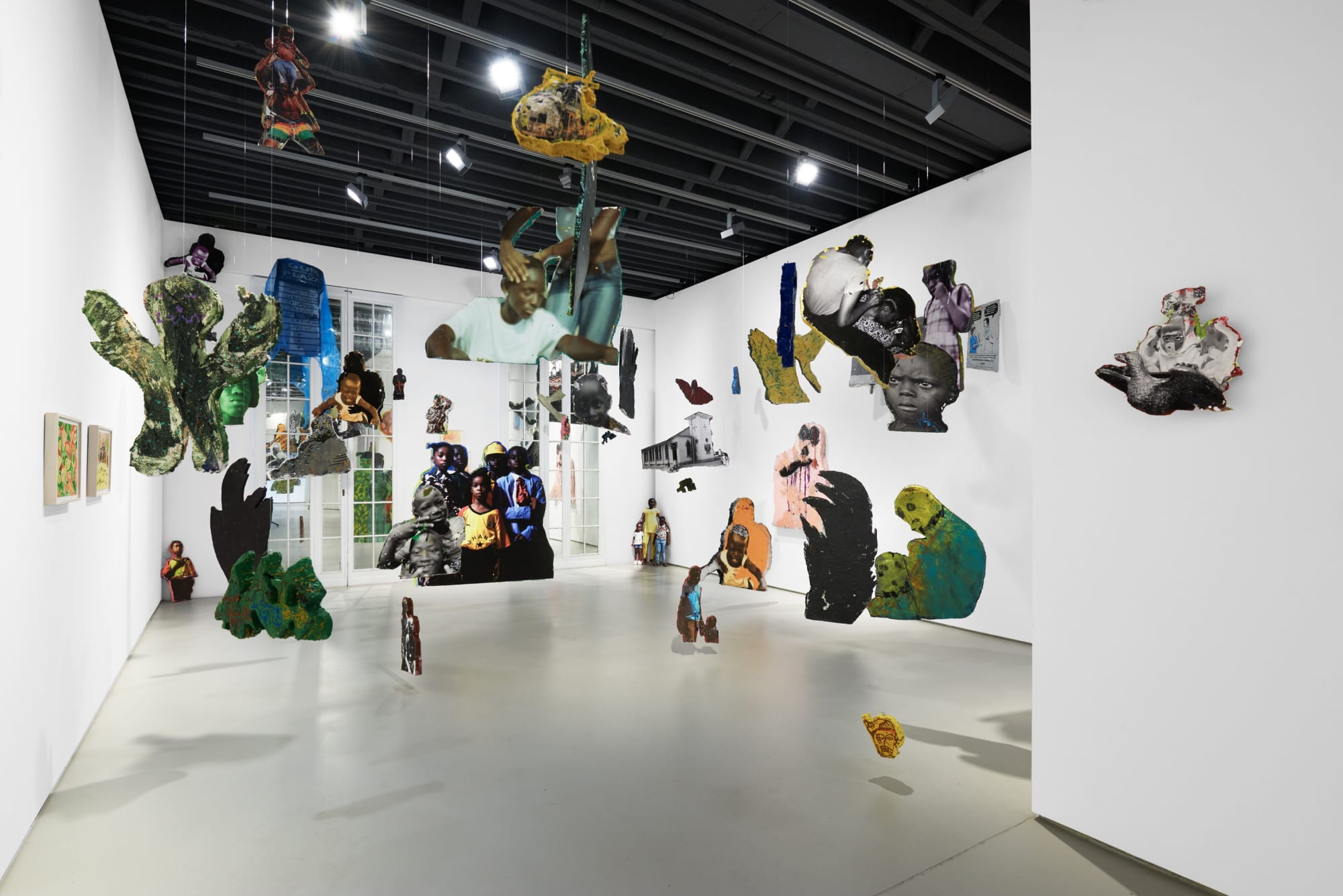 Installation view of the 2023 exhibition “Lloyd Foster: Double Double” with view of white floors, walls, artworks and ceiling.
