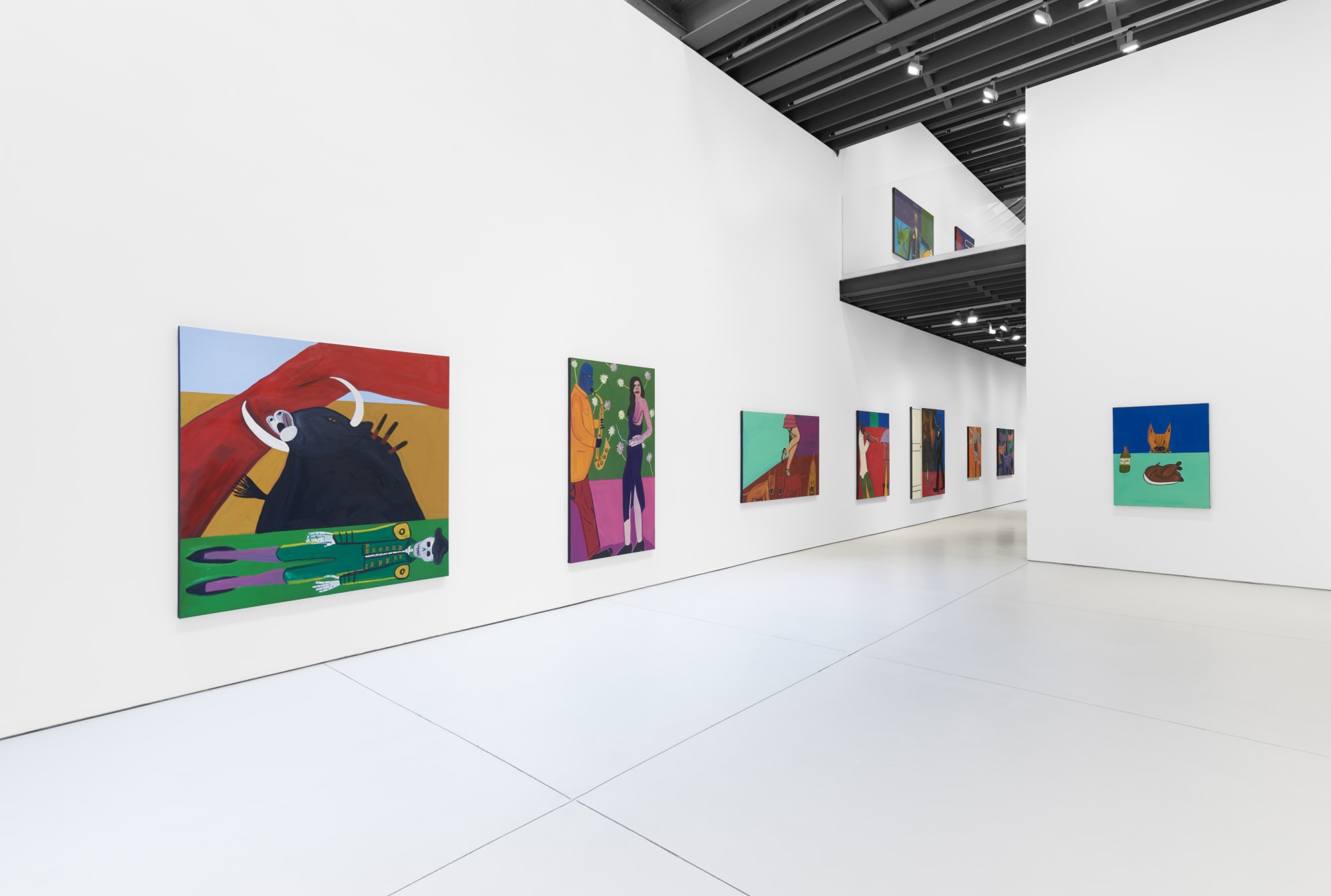 Installation view of the 2023 exhibition “Marcus Jahmal: Interiors” with view of person for scale, white floors, walls, artworks and ceiling.