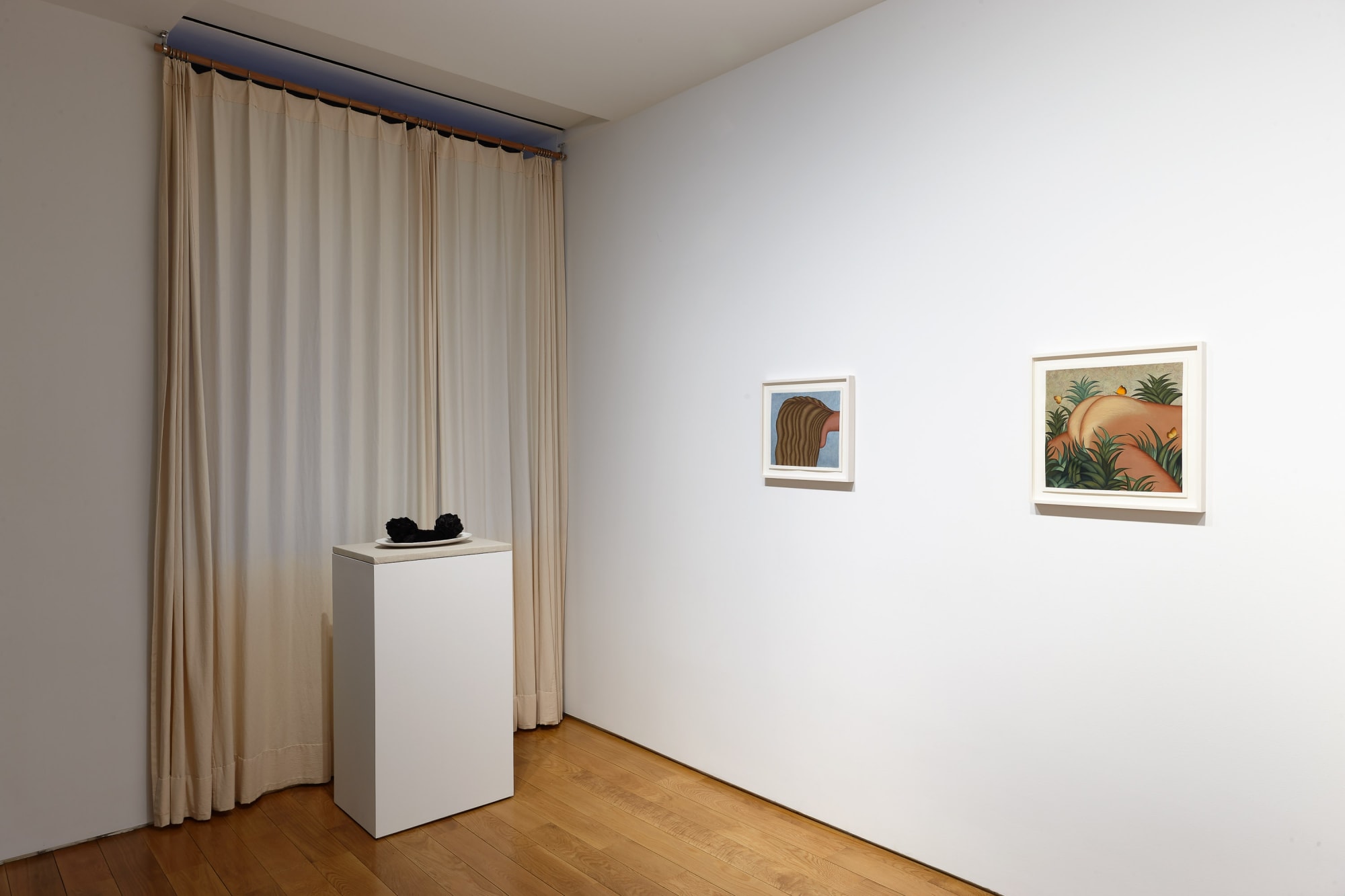 Installation view of Julie Curtiss's solo show at the gallery featuring paintings and sculptures. Two paintings and a sculpture.
