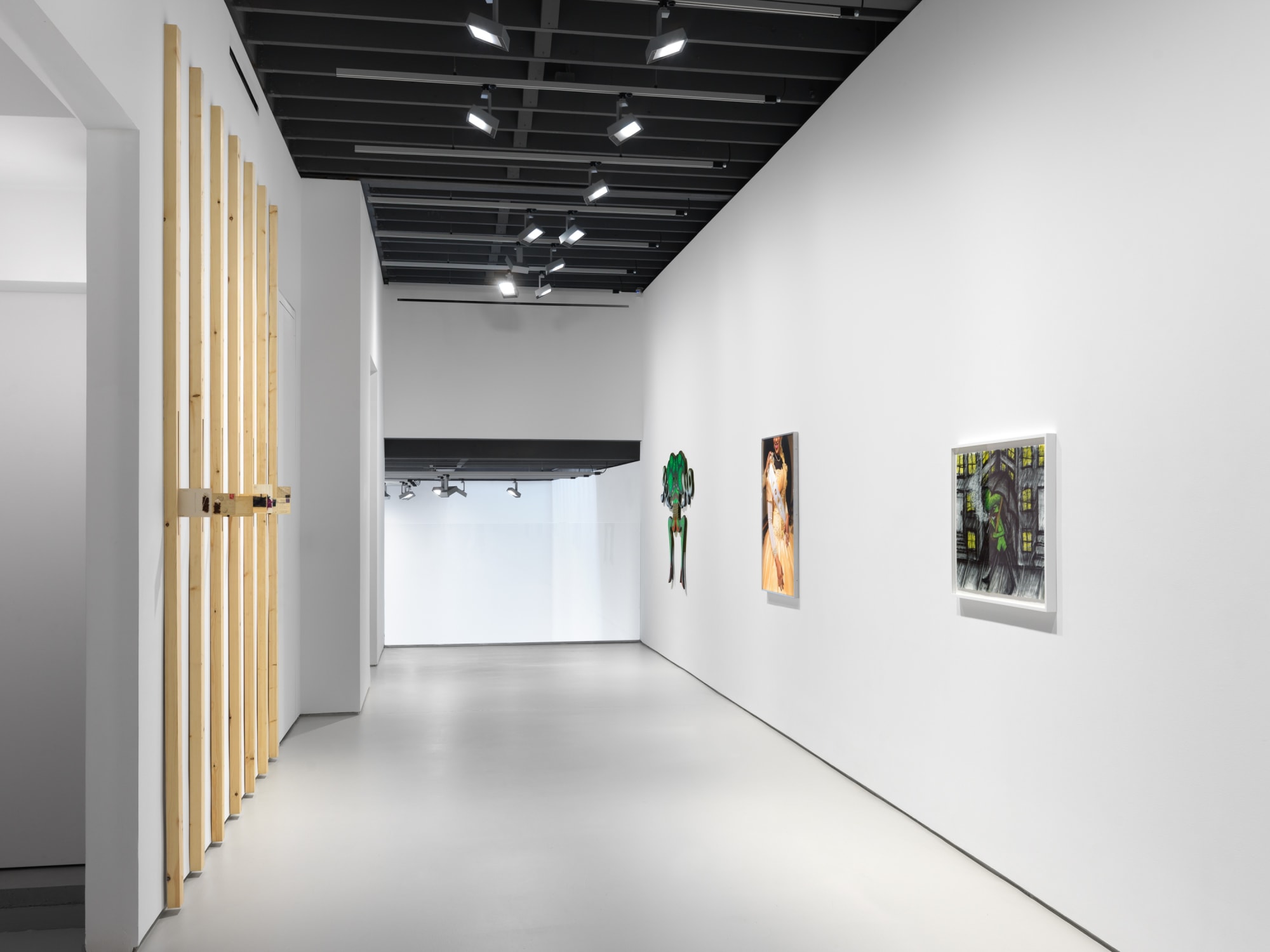 Installation view of "11".a group exhibition of artists at the gallery. This view shows the walkway in between Barrington's work and other smaller pieces in the show.