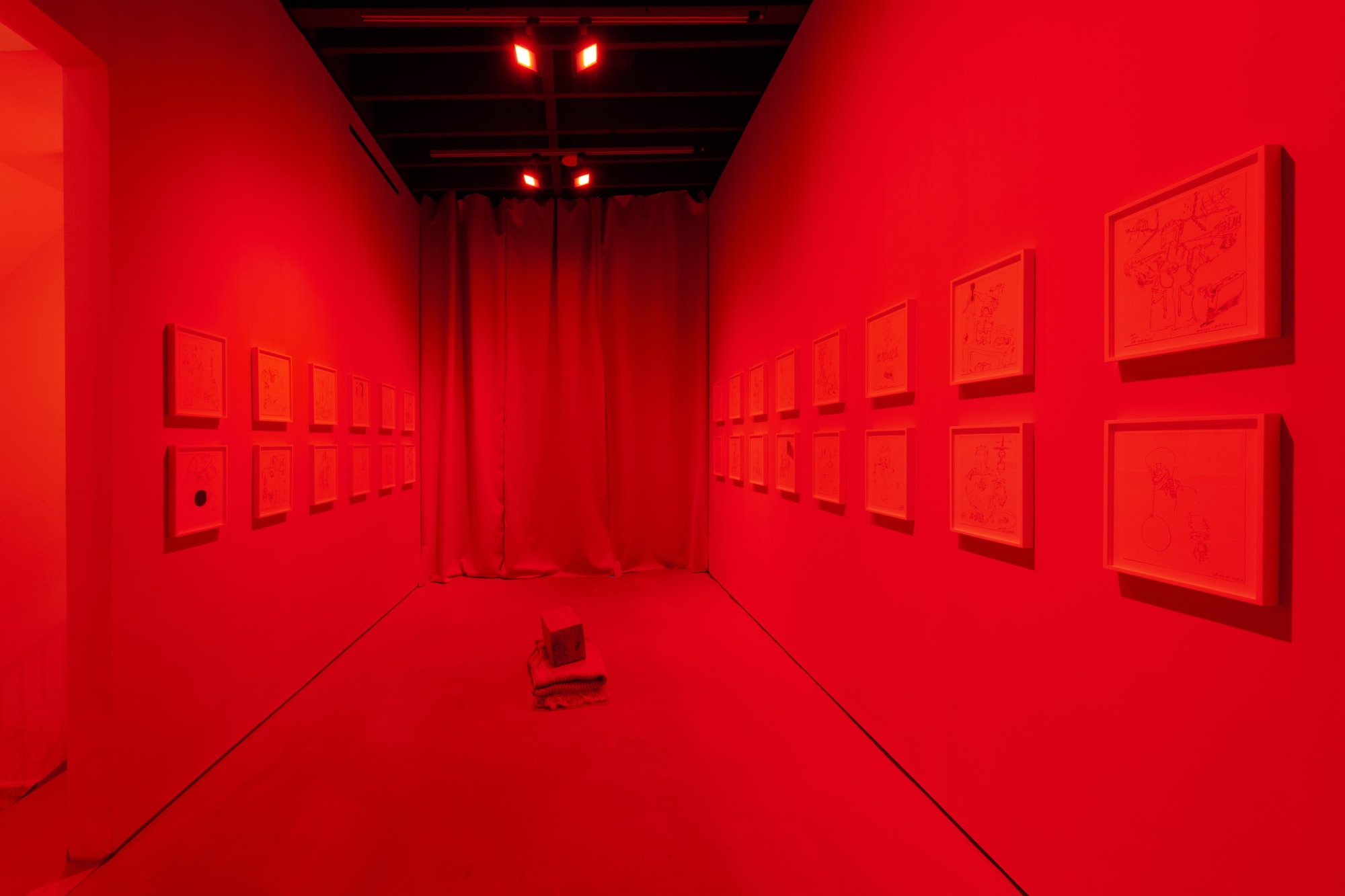 Installation view of John Bock's Dead + Juicy, a multimedia installation including film, sculpture, and a performance. Bock's all red room.