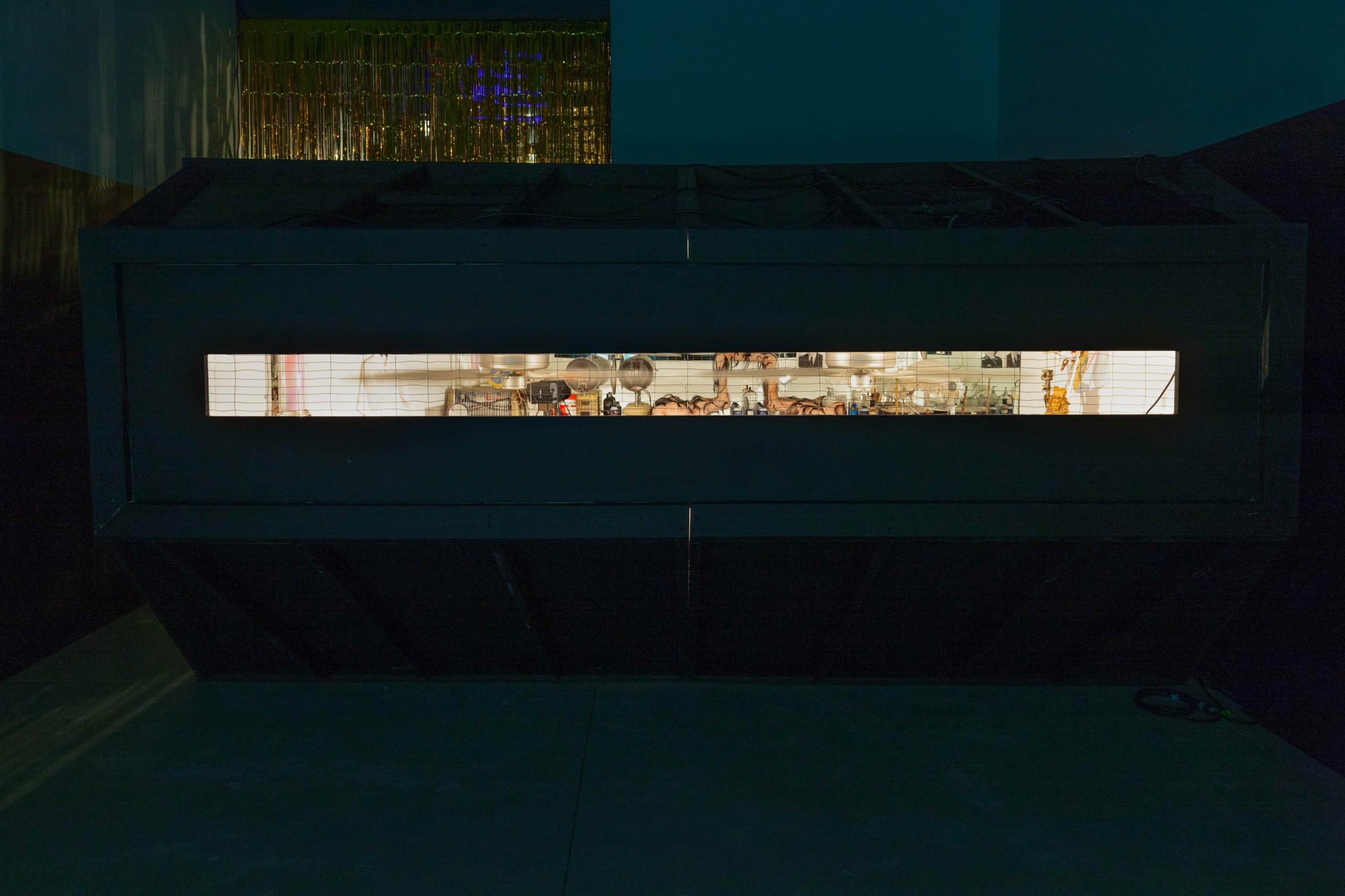 Installation view of John Bock's Dead + Juicy, a multimedia installation including film, sculpture, and a performance. Film presented.