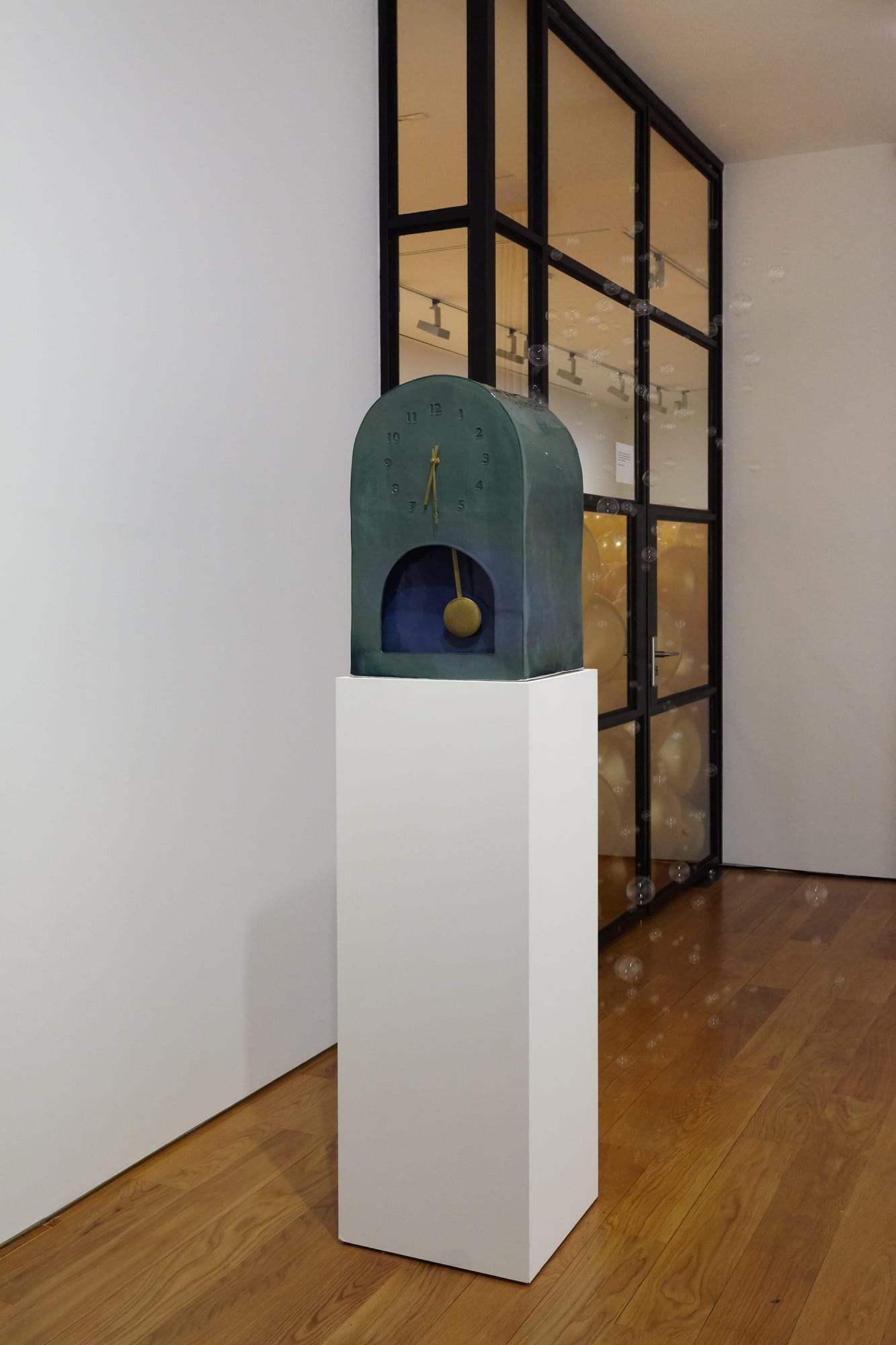 Installation view of exhibit titled the Party. Jamie Isenstein's clock shown.