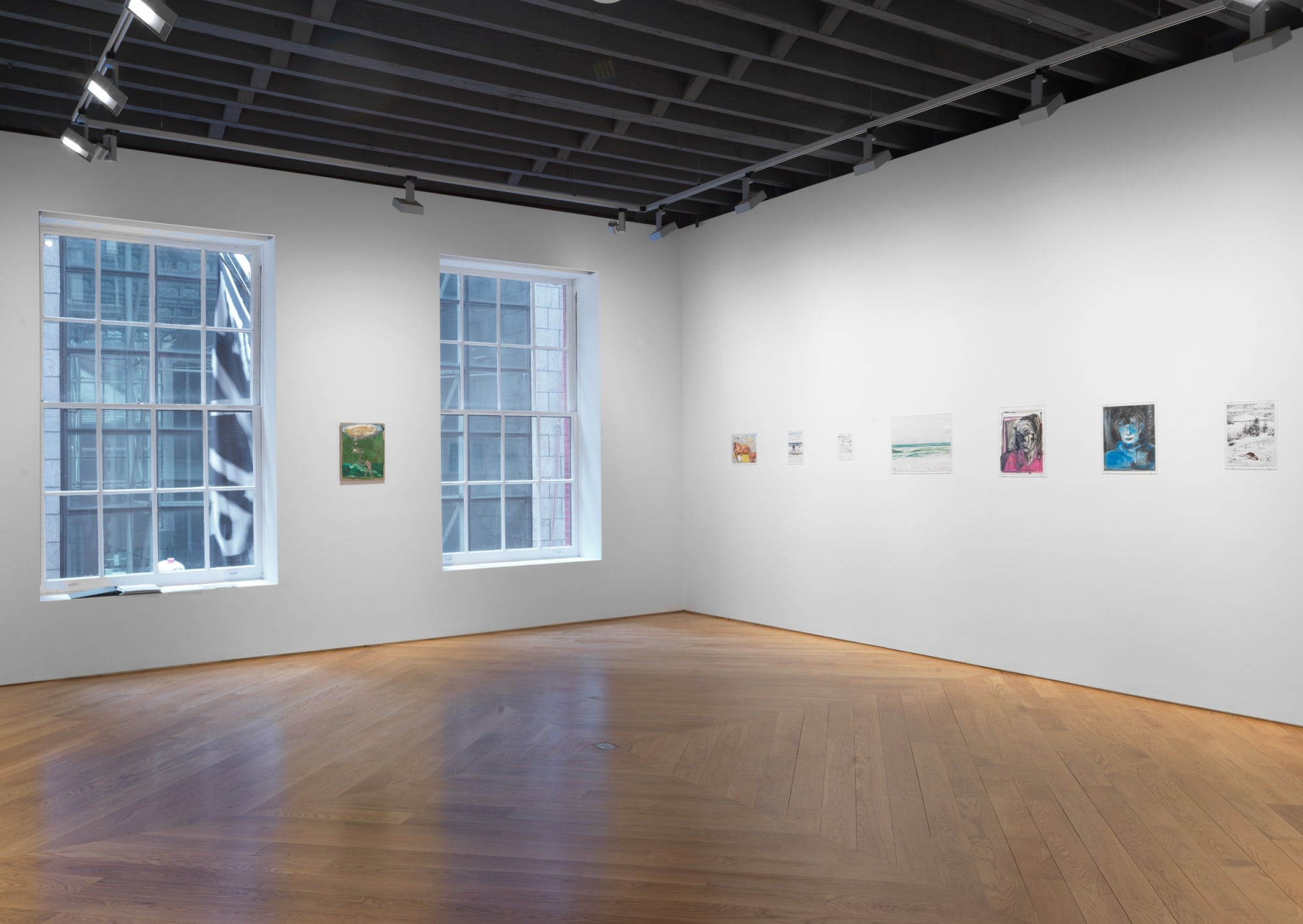 Installation view of Nicole Eisenman show, corner angle of paintings.
