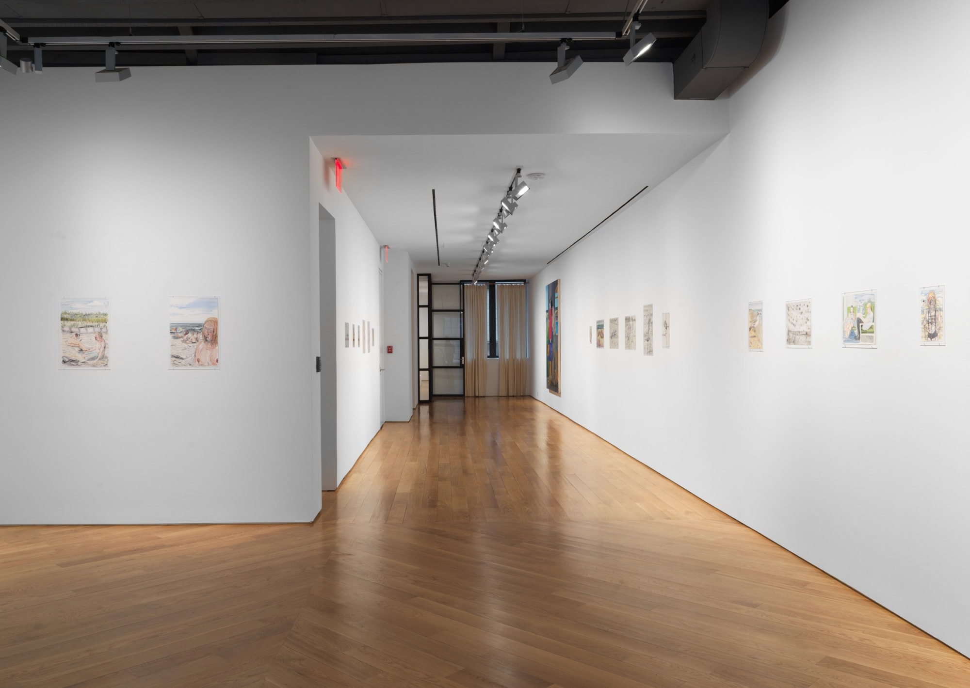 Installation view of Nicole Eisenman show from a larger viewpoint. A few paintings featured.