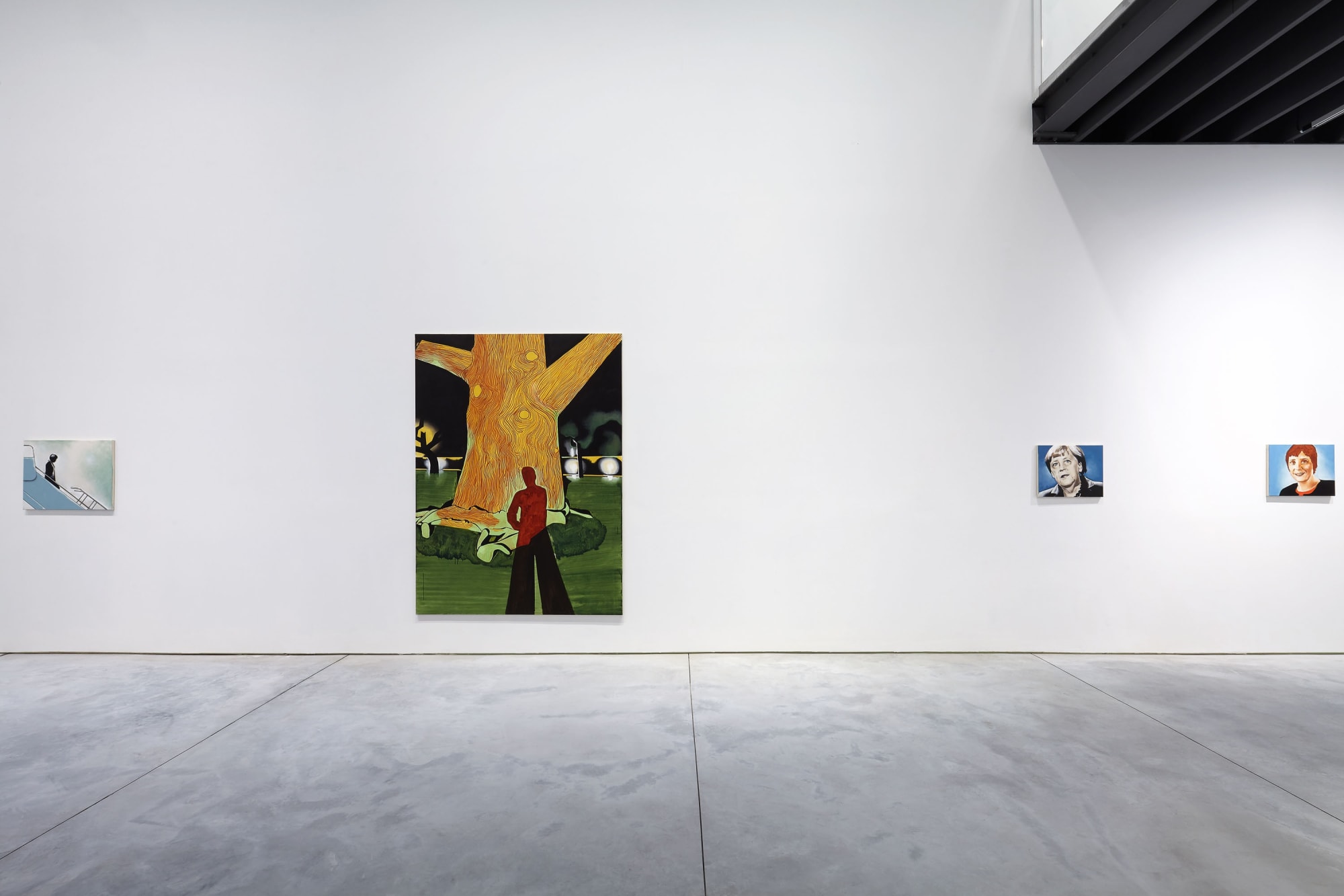 Installation view of Wilhem Sasnal's solo show. Sasnal's Baobab next to smaller works featuring portraits of Angela Markel.