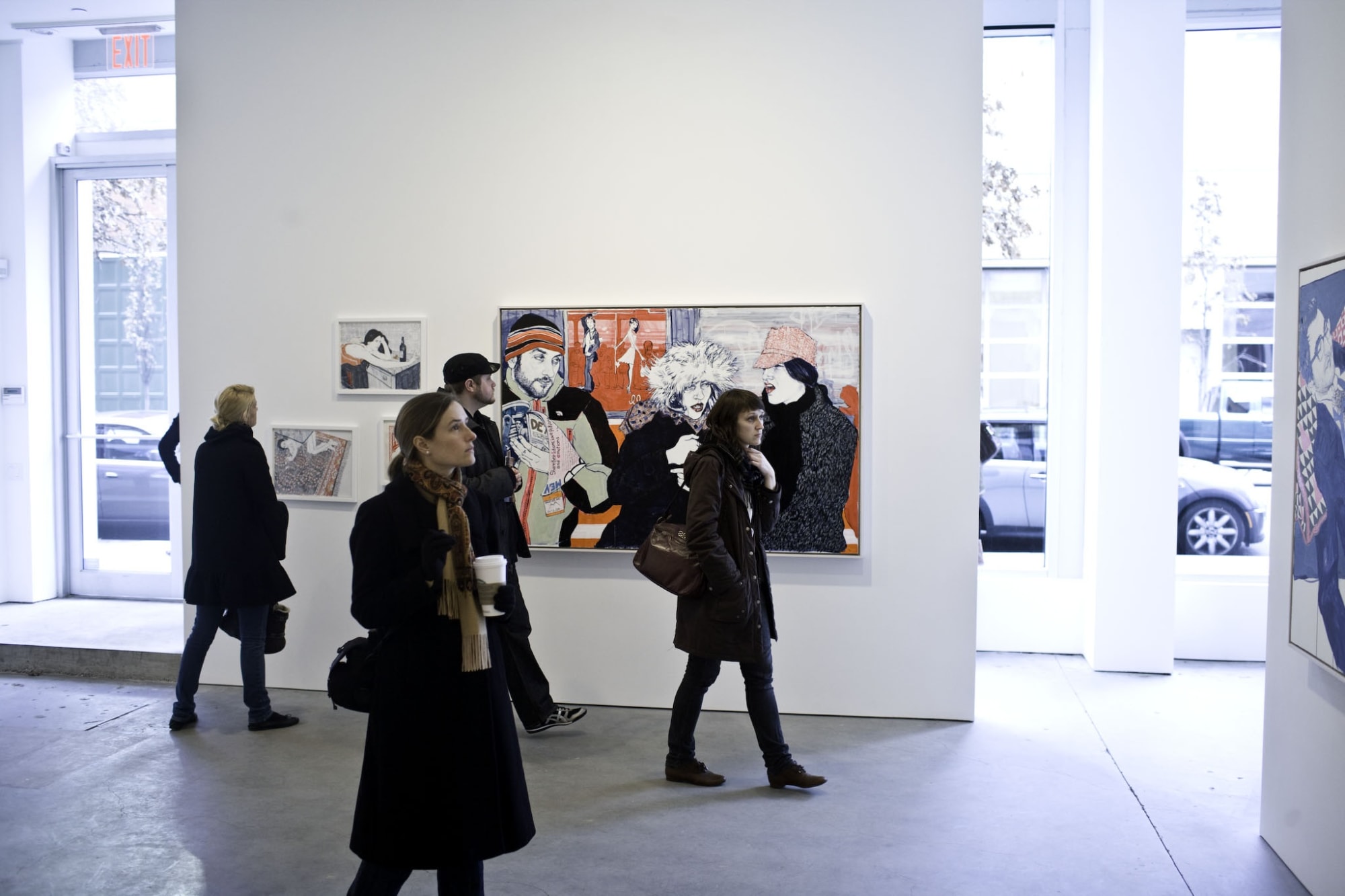 Installation view of Susan Inglett Gallery with work by Hope Gangloff hanging on the walls and viewers in the Gallery space