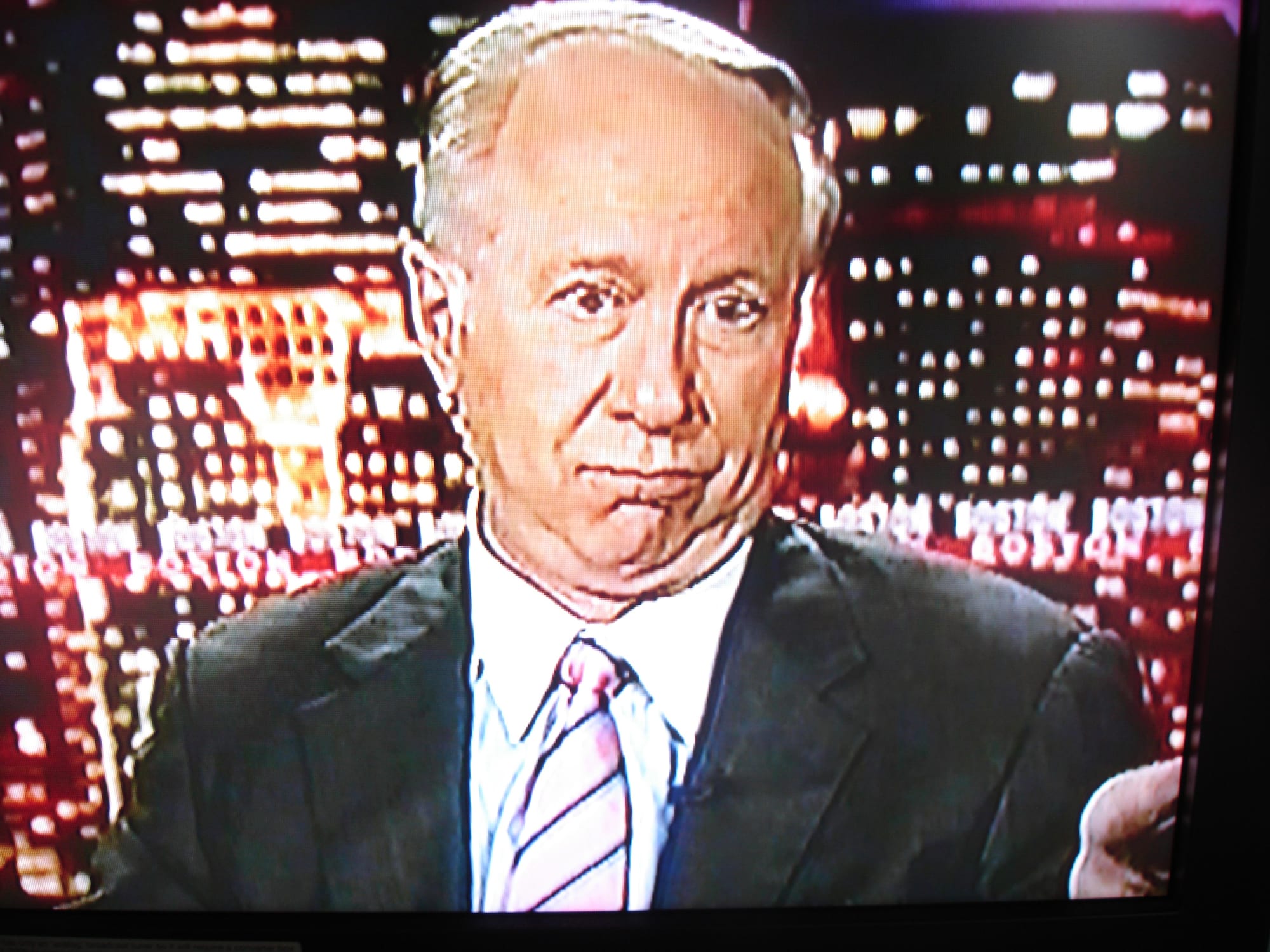 Screenshot of David Gregen looking into the camera