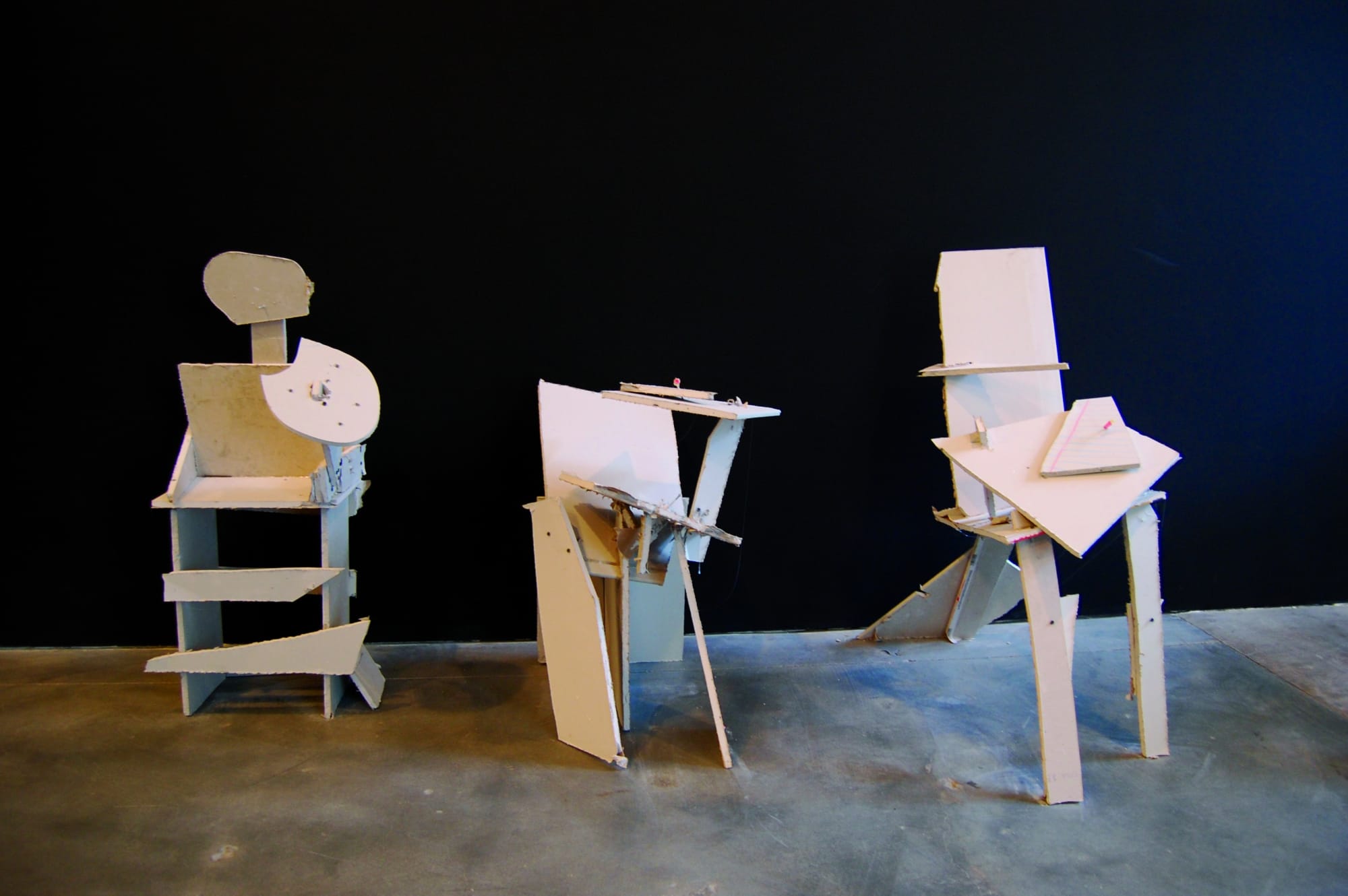 Three sculptural chairs fashioned to look as if they are 2D