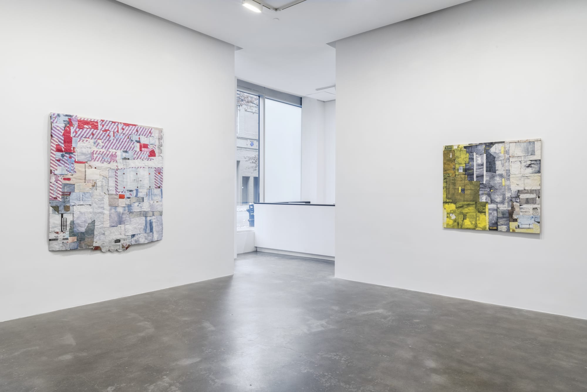 Installation view of two Hays assemblages on wall