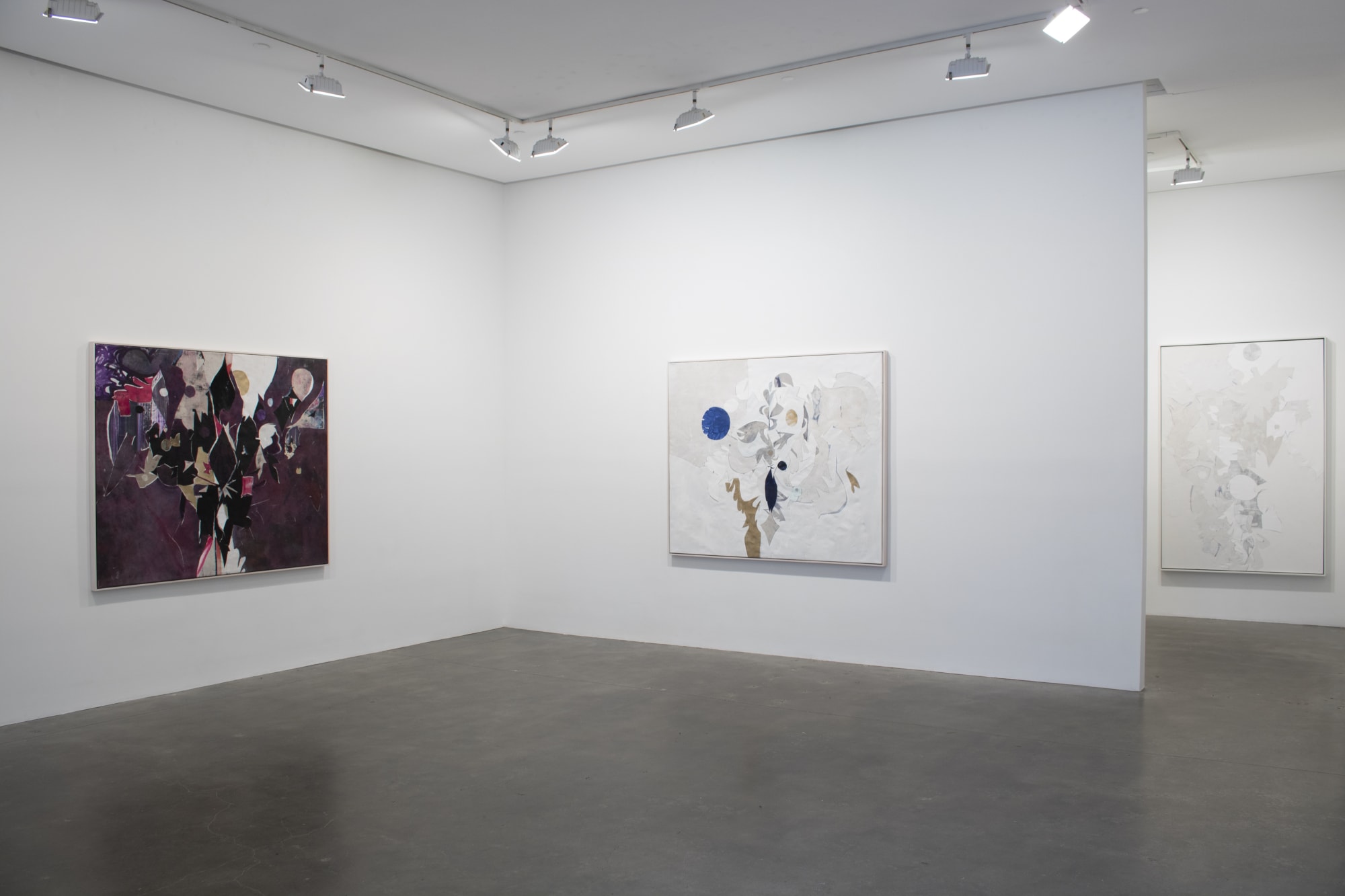 Installation view of Susan Inglett Gallery with two abstract paintings made from collaged remnants of earlier canvases by Ryan Wallace hanging on the walls