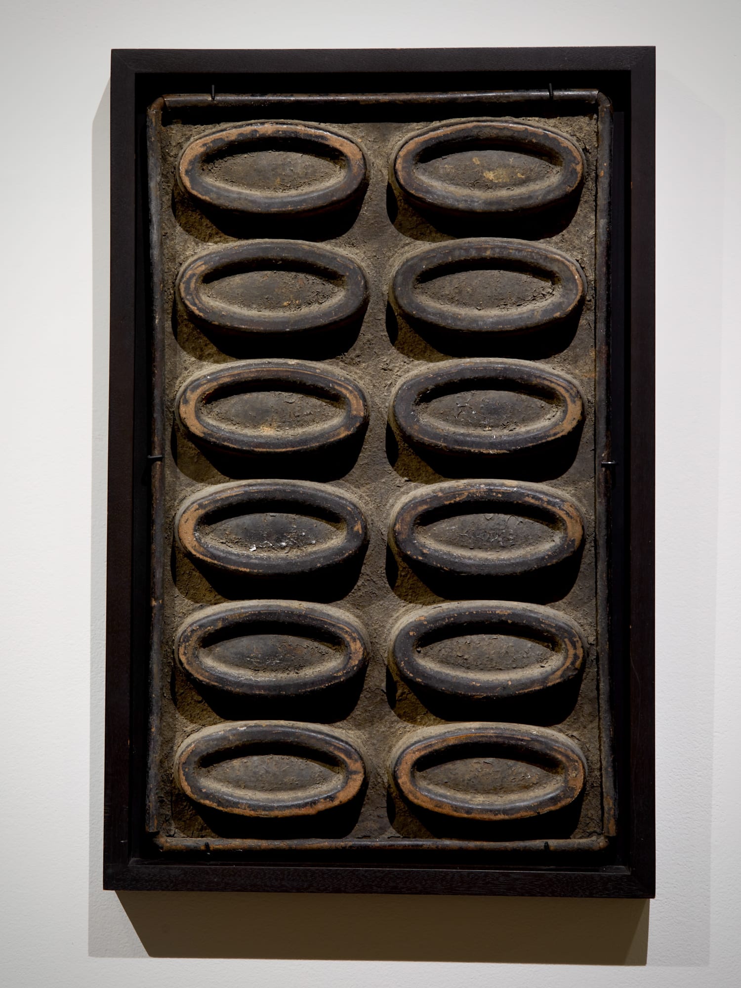 Industrial Mold (Possibly for Baking), early 20th century Pressed and formed metal (in contemporary float frame) 24 x 15 3/4 in. (61 x 40 cm.) (AU 269) SOLD