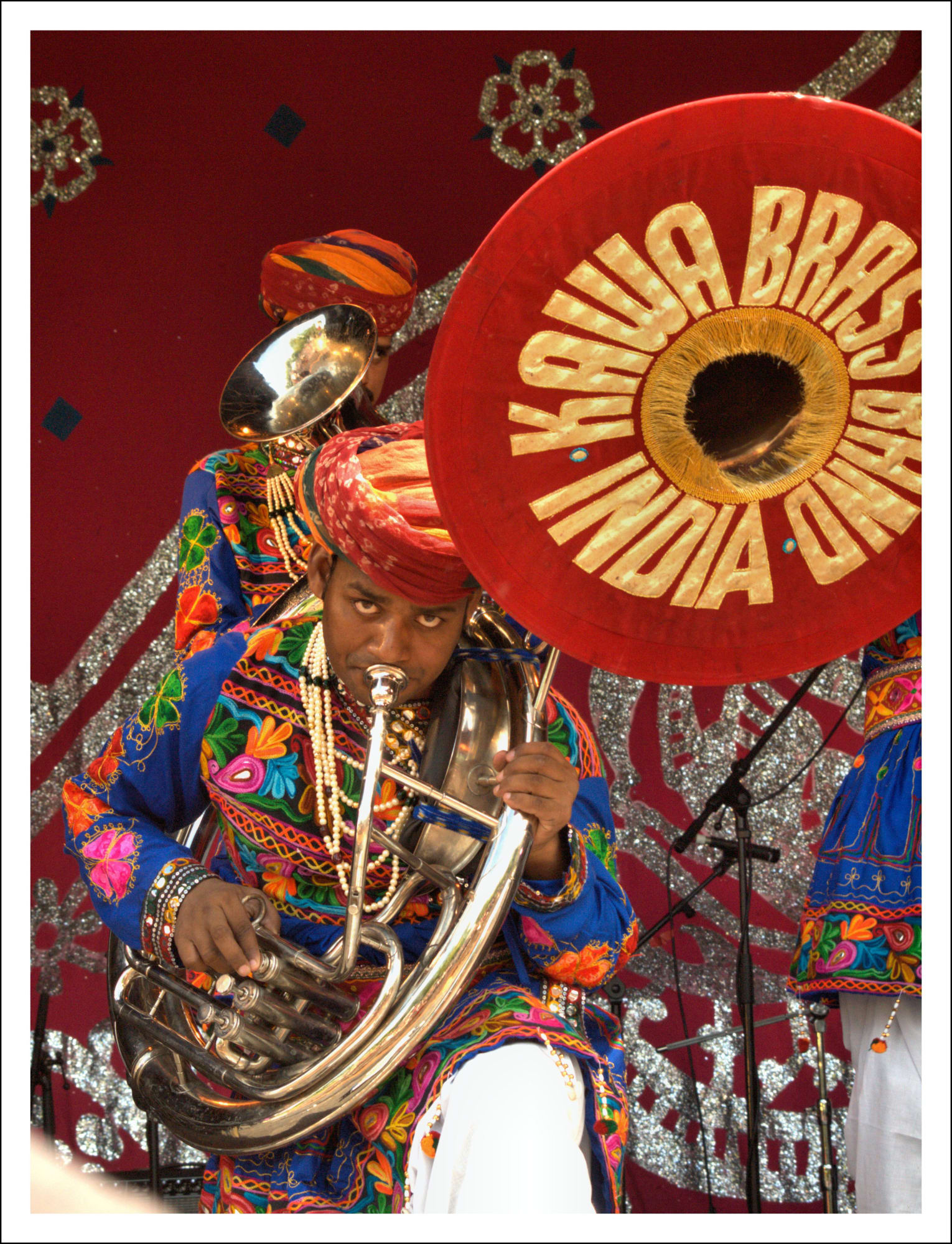 Member of the Jaipur Kawa Brass Band playing a Sousaphone at Glasgow Mela in 2014. “Brass bands have had a presence in India since the 18th century when the ensembles were introduced by the ruling British colonialists. Today, brass bands are firmly a part of Indian tradition and are hugely popular at weddings, births, national events and religious ceremonies.” Glasgow Mela is a multi-cultural festival that celebrates music, dance, and arts. Ben Allison, 2014