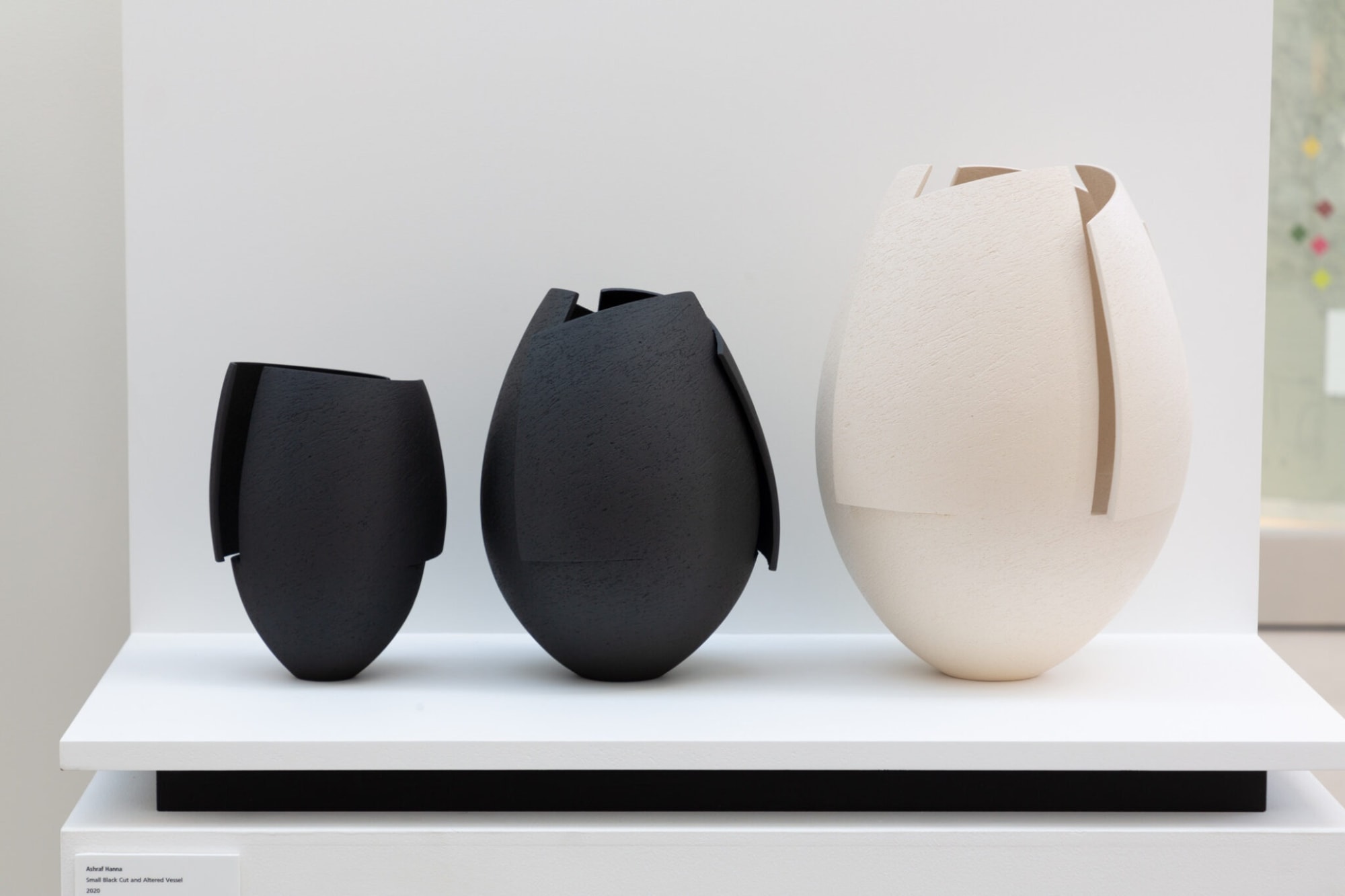 Black Cut and Altered Vessel by Ashraf Hanna, Ceramic, 21 cm high, 2020 Black Bulbous Cut and Altered Vessel by Ashraf Hanna, Ceramic, 27 cm high, 2020 White Bulbous Cut and Altered Vessel by Ashraf Hanna, Ceramic, 35cm high, 2020