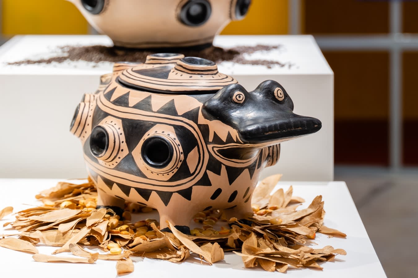 On a bed of Amazonian seeds: Yakakumalu Wauja (Coletivo Wauja), Kamalu Hai (Ceramic Pot III), 2021, clay ceramic, 25 x 51 x 37 cm