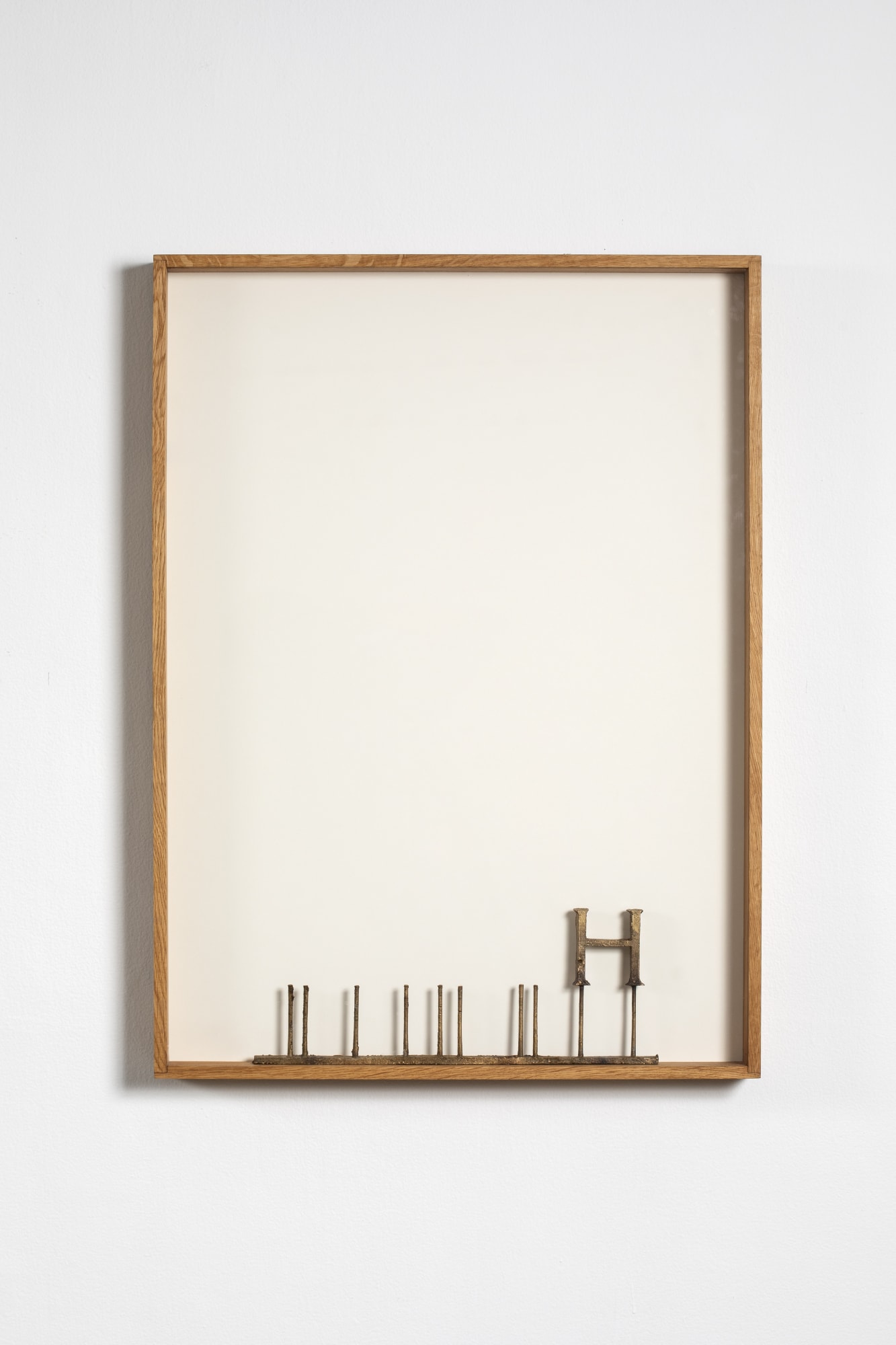 Shilpa Gupta H (TRUTH) Gun metal, wood 30.5 x 22.5 x 2.5 in 2023 Edition of 3